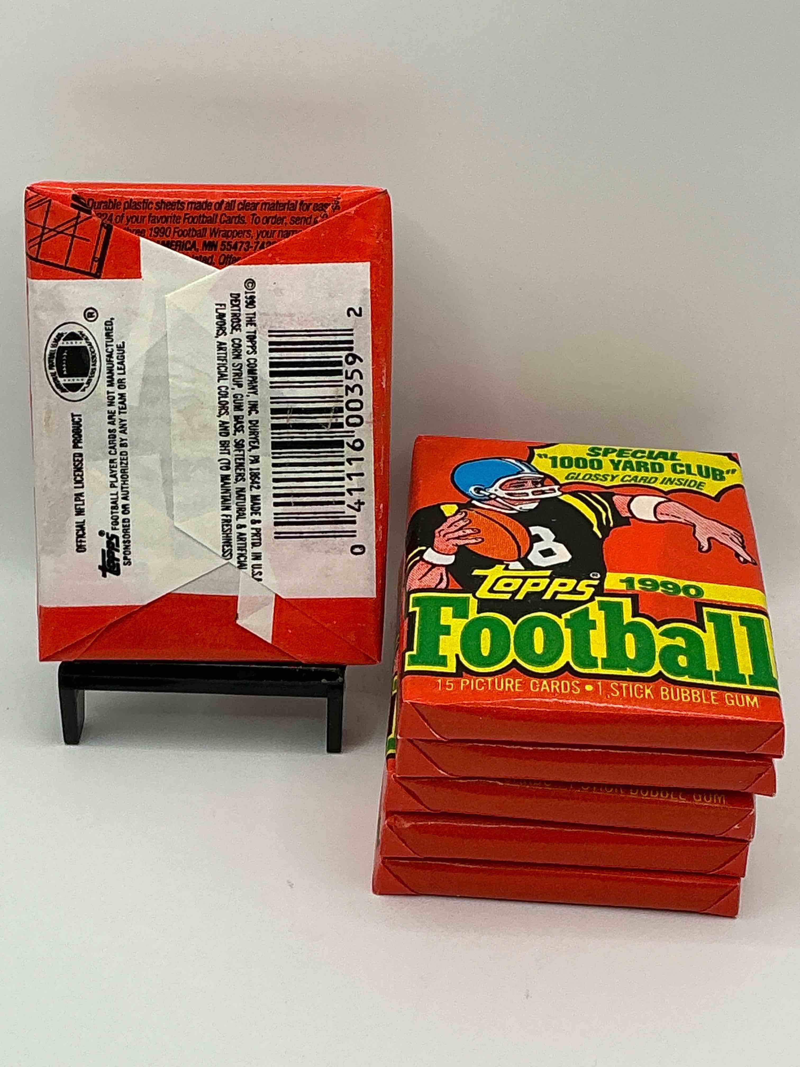Condition photo showing New/Like New for The Last Year Of Football Wax! Joe Montana, Emmitt Smith & Barry Sanders!? 1990 Topps Football Unopened Sports Card Wax Pack, Direct From Original Retail Box! Getting Hard To Find! Search For Early Barry Sanders & Jerry Rice & So Much More!