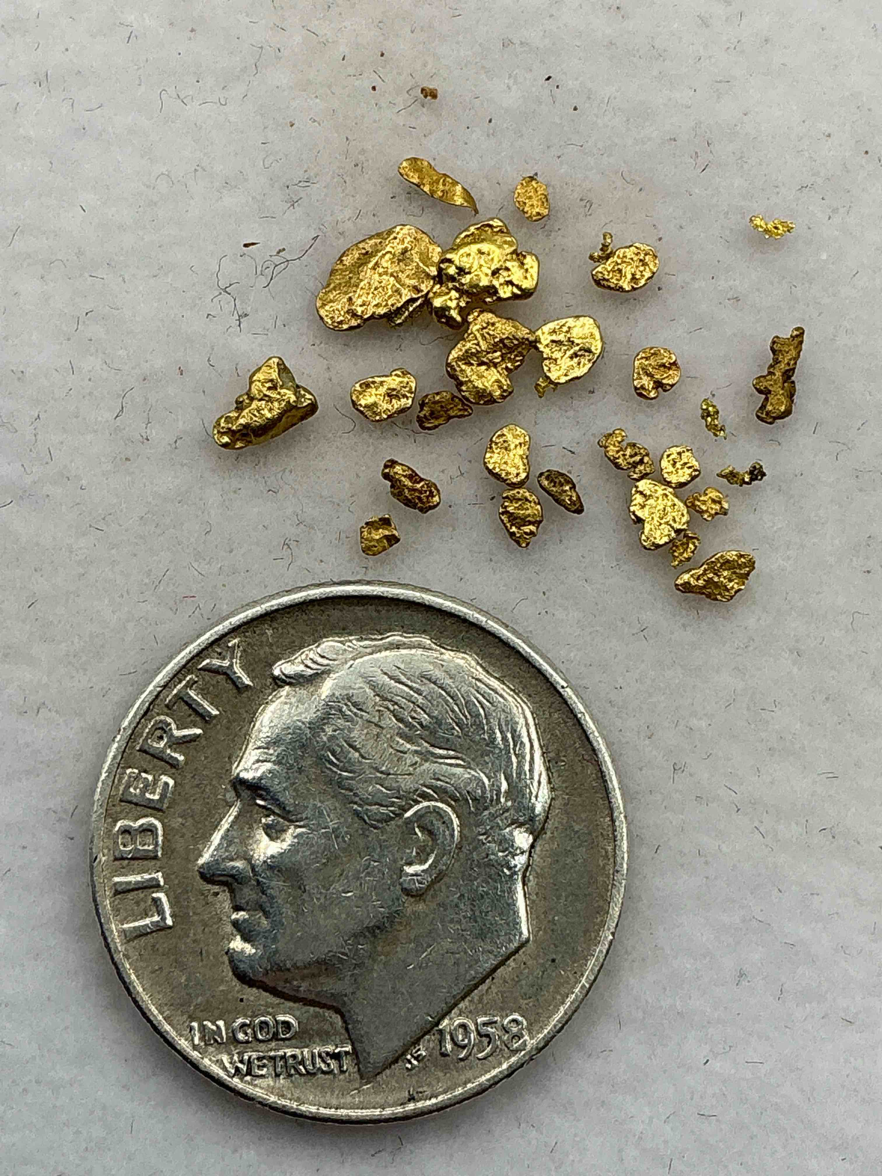 Condition photo showing New/Like New for Genuine Gold Nuggets! Gold Nuggets Fresh From Prospecting North Carolina Mountains, Total Weight Of All Nuggets Is Approximately .5 Grams. These Gold Nuggets Typically Test At Between Approx 22-24 Karat. Gold In Raw, Prospected Form Is Extremely Hard To Find & Much Rarer Than Any Refined Form. Get In On The Gold Craze... Gold Has Increased In Value Over 40% Since 2025! U.S. Dime For Size Reference Only (not included). Gold Vile In Image Included. Own Genuine, Gold Nuggets!