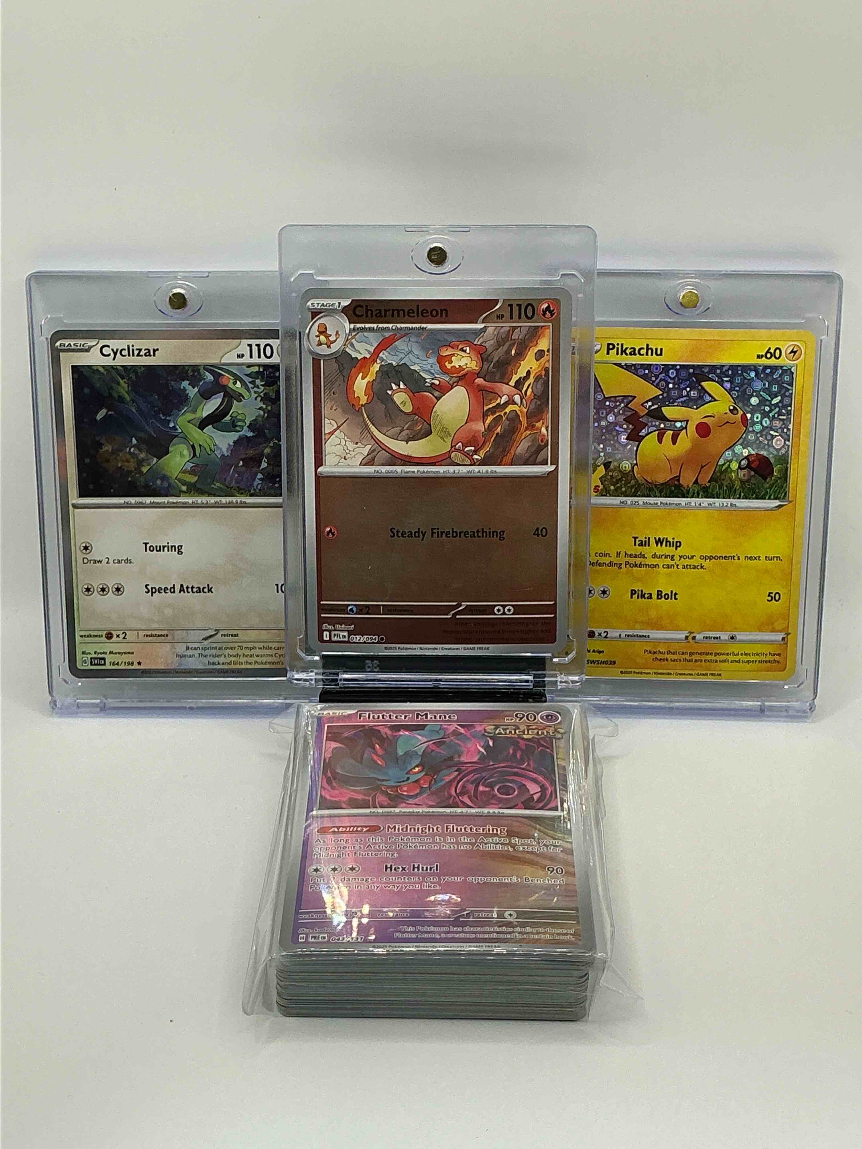 Pokémon Palooza! Silver & Orange Holographic Steady Firebreathing Charmeleon! Silver & Green Holographic Touring Speed Attack Cyclizar! Silver & Yellow Shimmer Tail Whip Pika Bolt! Along With 50 Other Pokémon Heroes, Holos & Commons!