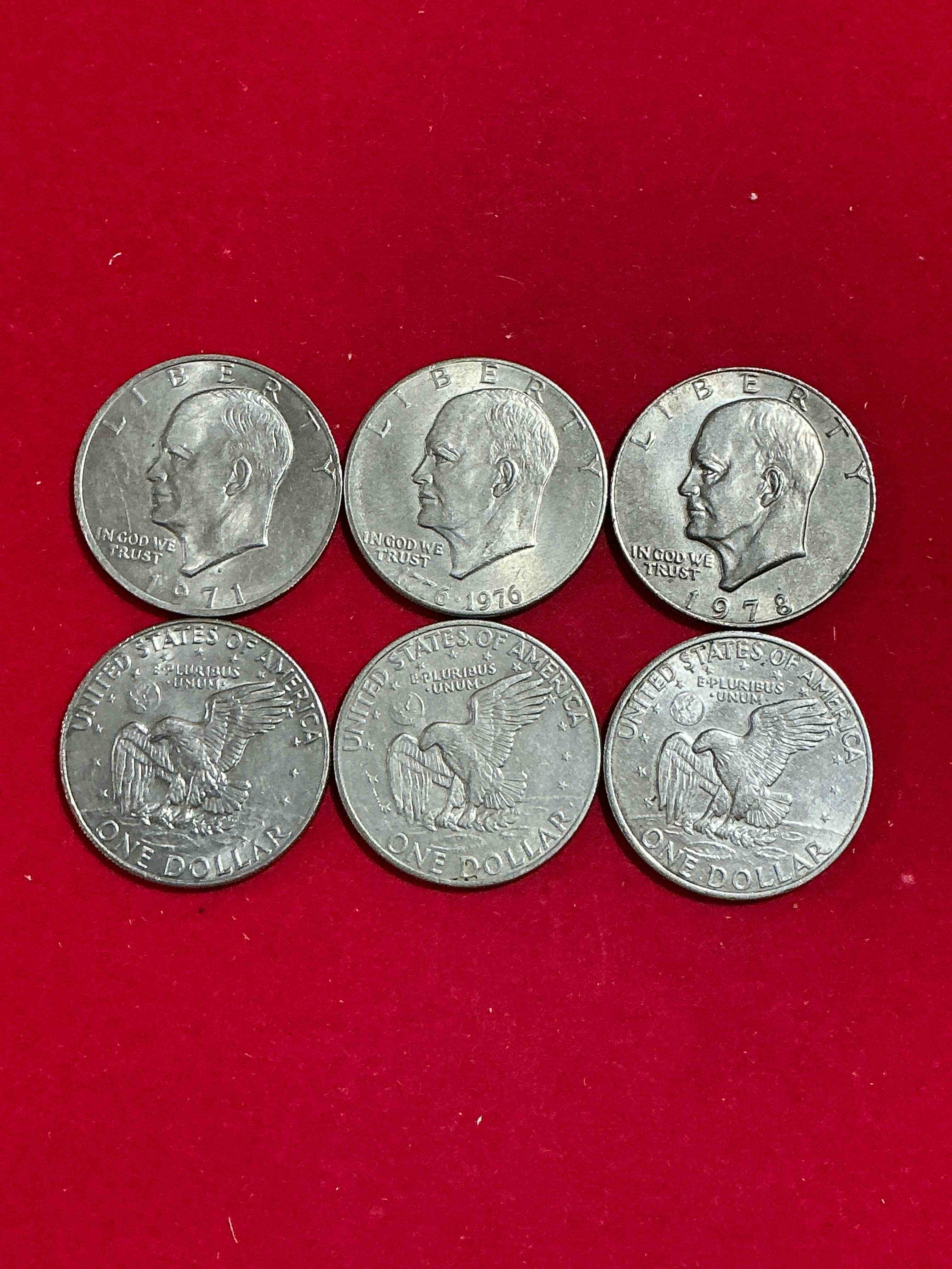 Condition photo showing Good Condition for Gorgeous Eisenhower Dollar Coins! These Striking, Large U.S. Coins Were Minted From 1971-1978. Here Are Gorgeous Examples Of “Ike" Dollars From 1976 & Other Years! These Coins Have Become Immensely Popular With Collectors & Some Have Great Toning!