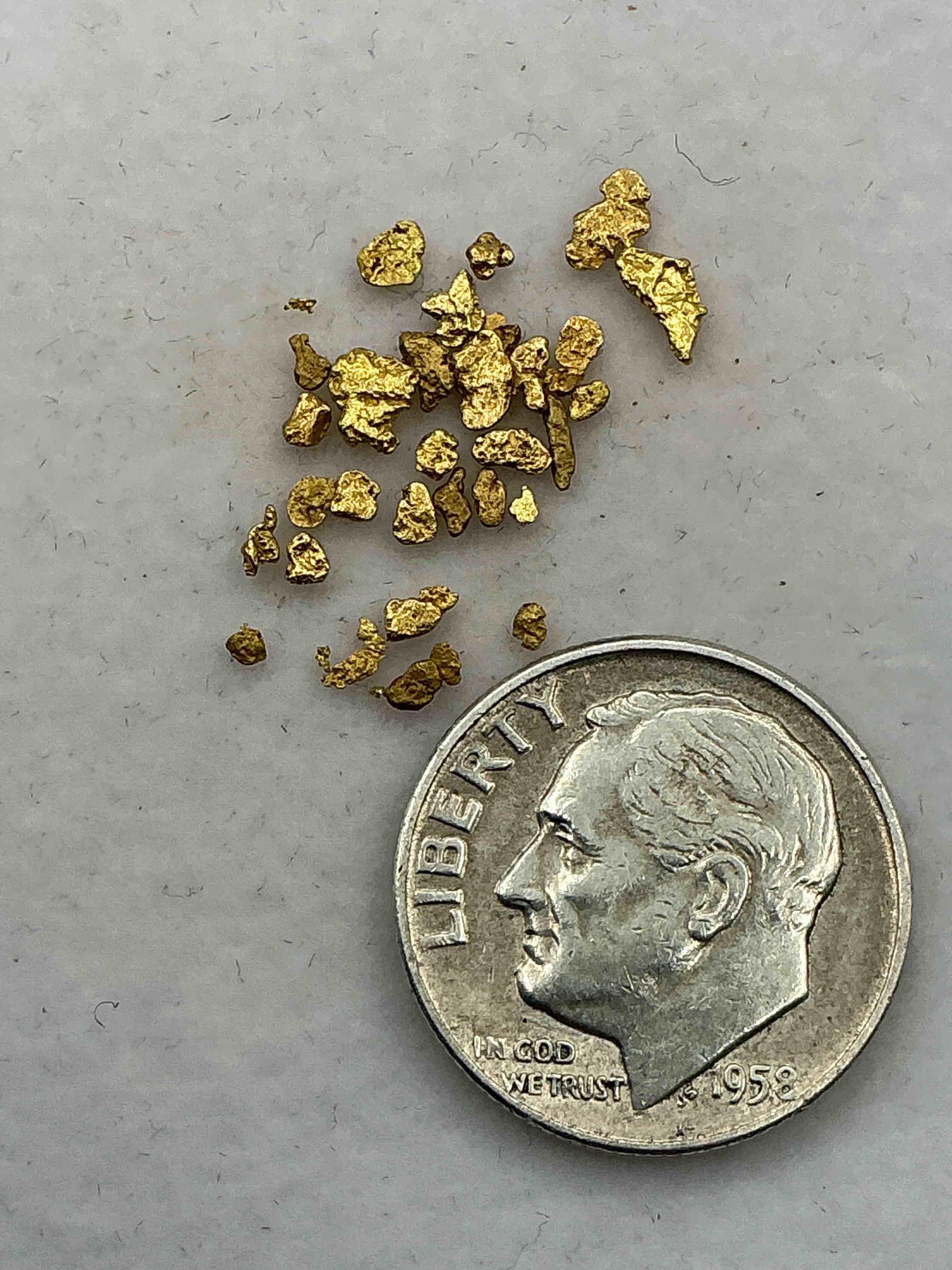 Condition photo showing New/Like New for Genuine Gold Nuggets! Gold Nuggets Fresh From Prospecting North Carolina Mountains, Total Weight Of All Nuggets Is Approximately .5 Grams. These Gold Nuggets Typically Test At Between Approx 22-24 Karat. Gold In Raw, Prospected Form Is Extremely Hard To Find & Much Rarer Than Any Refined Form. Get In On The Gold Craze... Gold Has Increased In Value Over 40% Since 2025! U.S. Dime For Size Reference Only (not included). Gold Vile In Image Included. Own Genuine, Gold Nuggets!