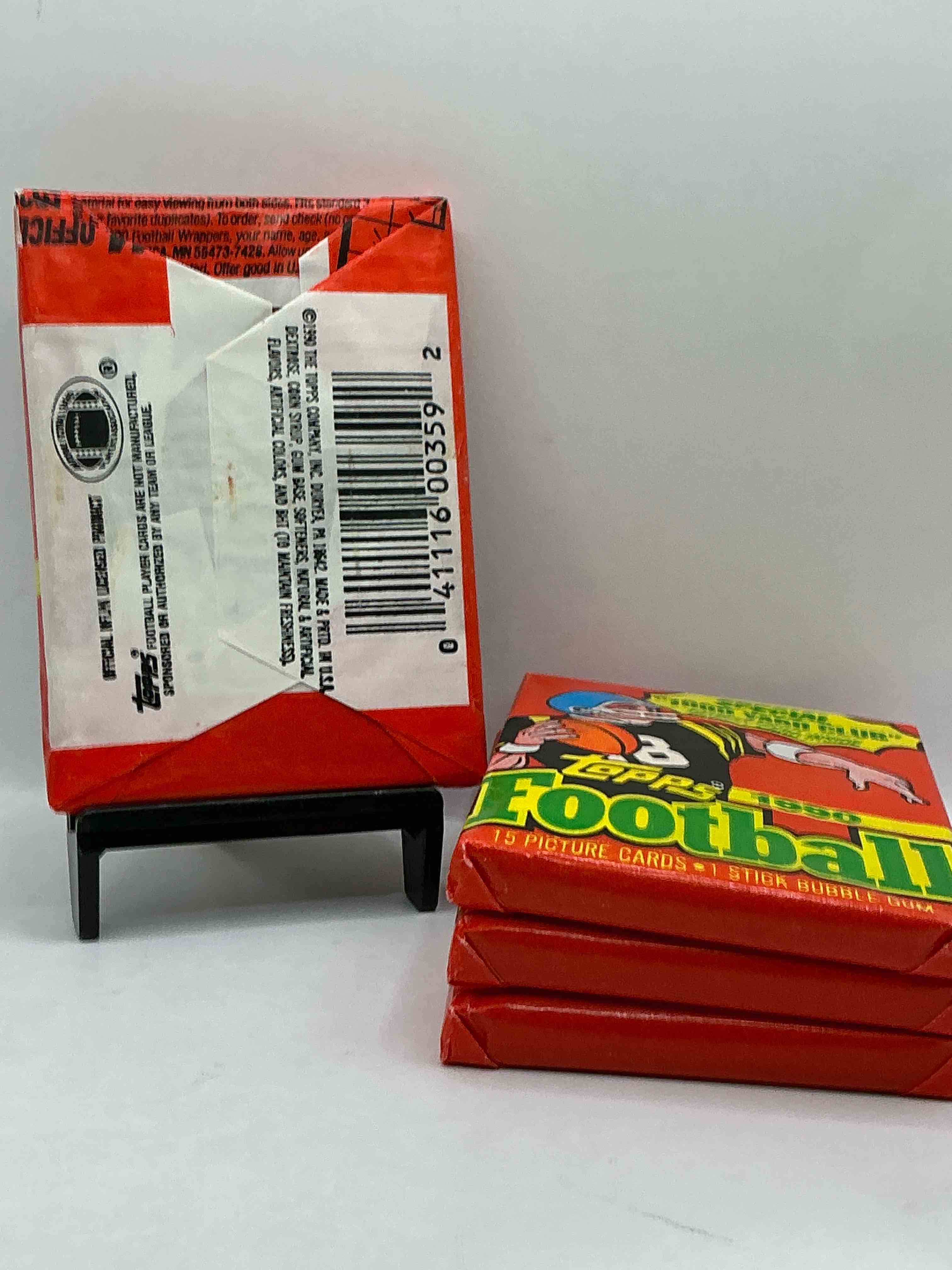 Condition photo showing New/Like New for The Last Year Of Football Wax! Joe Montana, Emmitt Smith & Barry Sanders!? 1990 Topps Football Unopened Sports Card Wax Pack, Direct From Original Retail Box! Getting Hard To Find! Search For Early Barry Sanders & Jerry Rice & So Much More!