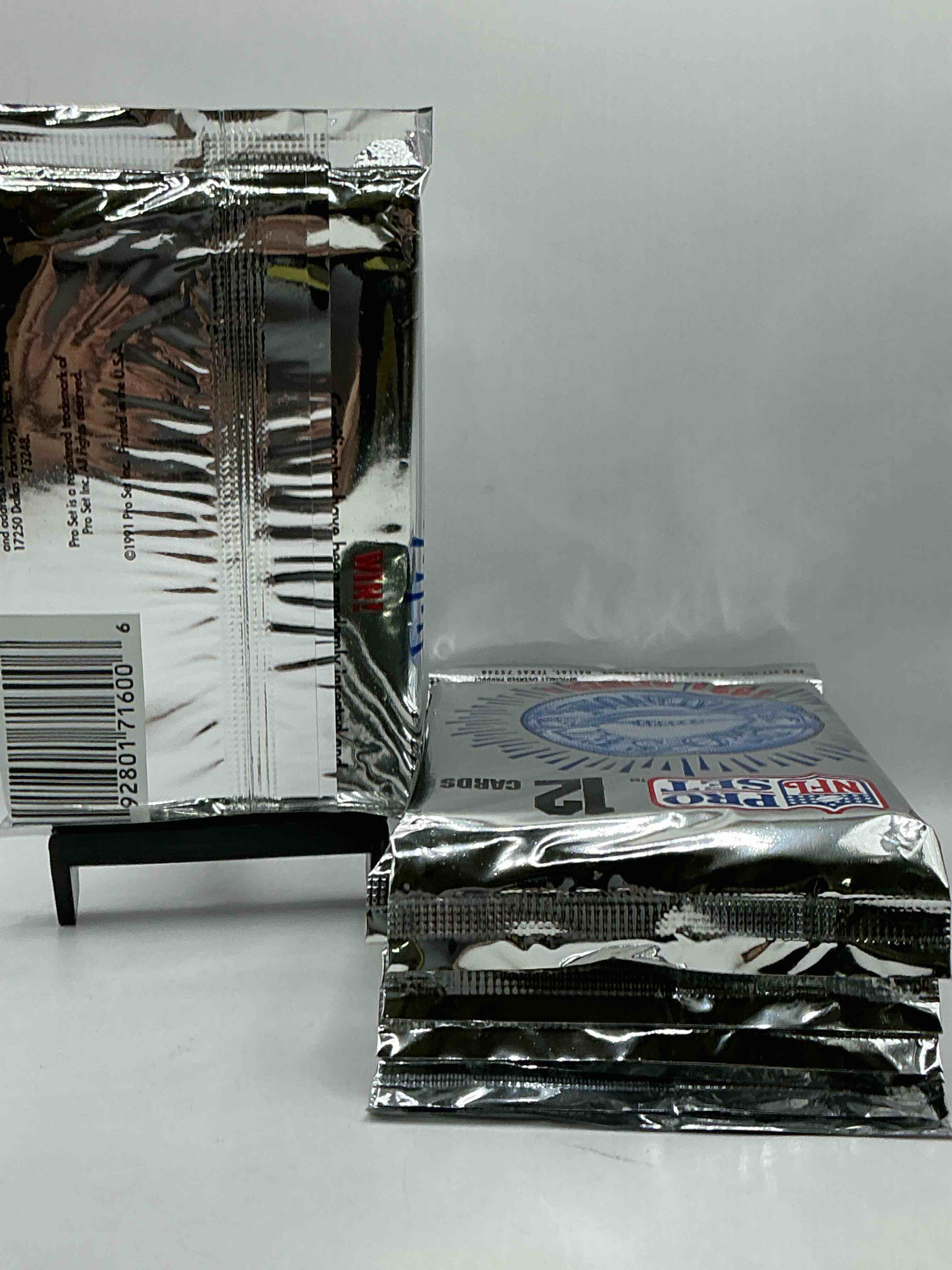 Condition photo showing New/Like New for Wow! 1991 Pro Set Football Sealed Card Packs Series I, Direct From Original Retail Case!Highly Sought After By Collectors As This Year Is Loaded With High Profile Cards!Search For Cards From Barry Sanders, Deion Sanders, Troy Aikman, Michael Irvin & Much More! Getting Hard To Find!