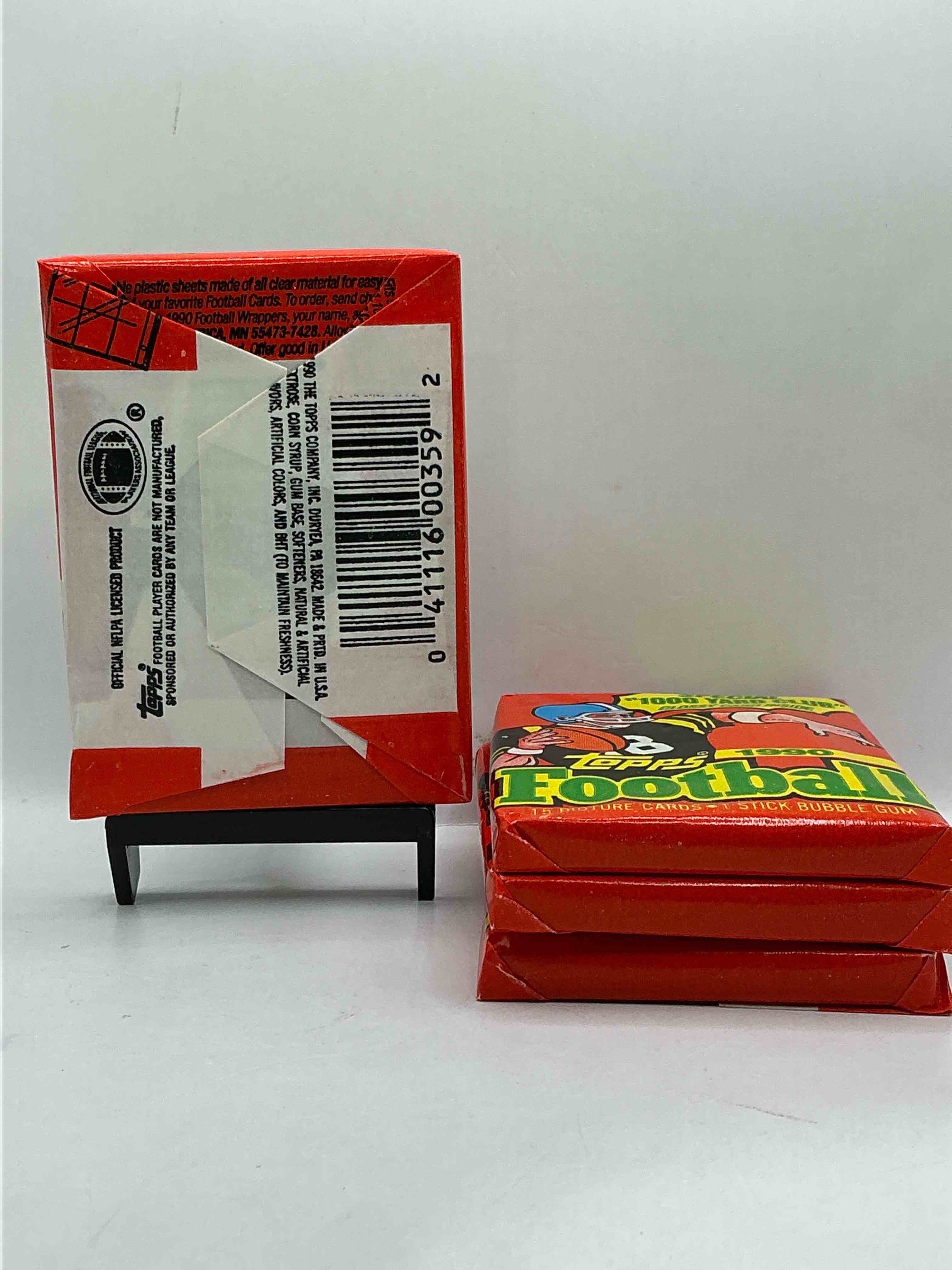 Condition photo showing New/Like New for The Last Year Of Football Wax! Joe Montana, Emmitt Smith & Barry Sanders!? 1990 Topps Football Unopened Sports Card Wax Pack, Direct From Original Retail Box! Getting Hard To Find! Search For Early Barry Sanders & Jerry Rice & So Much More!