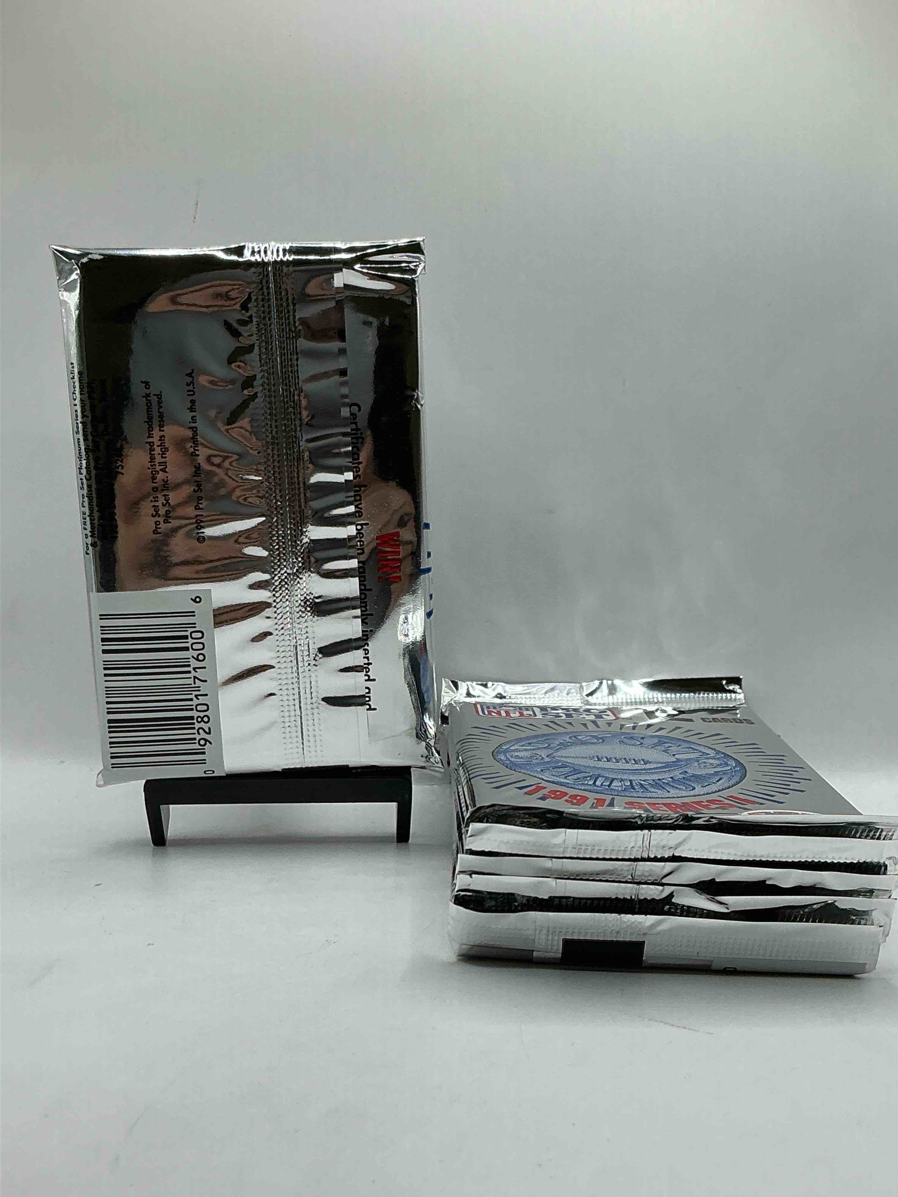 Condition photo showing New/Like New for 1991 Pro Set Platinum Edition Series I Unopened Packs! Search For Brett Favre Rookie & Bill Belichick Coach Rookie Card As Well As Santa Claus Card!