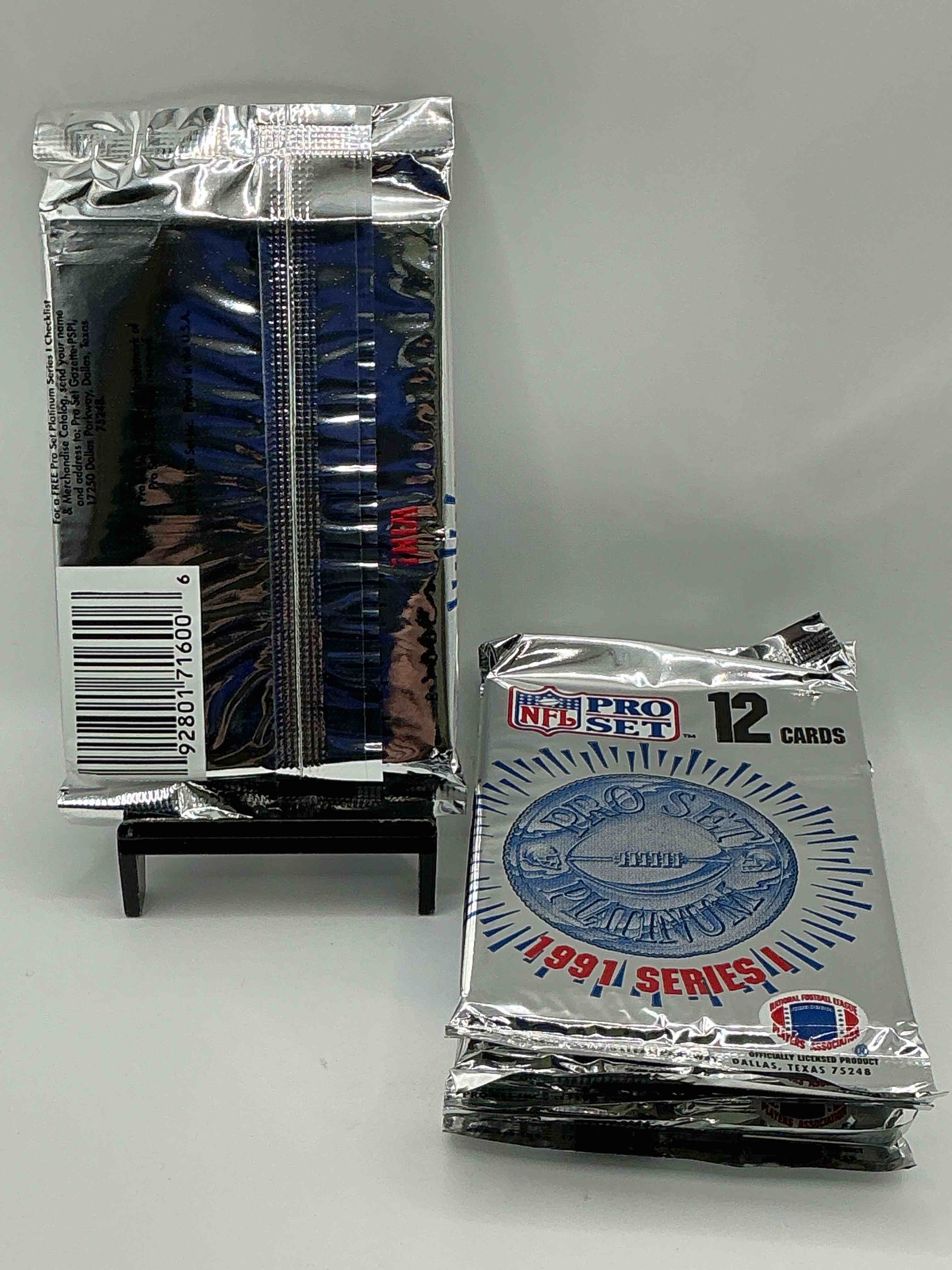 Condition photo showing New/Like New for 1991 Pro Set Platinum Edition Series I Unopened Packs! Search For Brett Favre Rookie & Bill Belichick Coach Rookie Card As Well As Santa Claus Card!