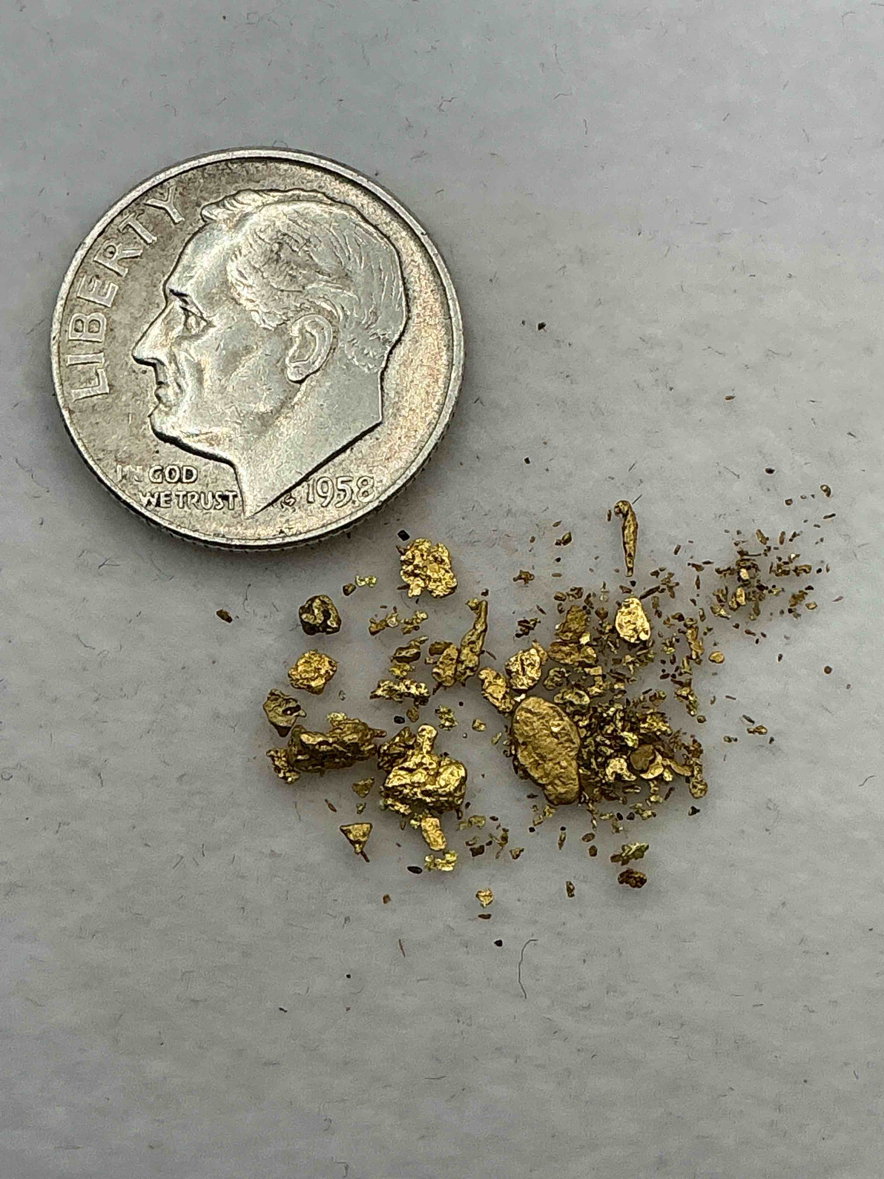Condition photo showing New/Like New for Genuine Gold Nuggets! Gold Nuggets Fresh From Prospecting North Carolina Mountains, Total Weight Of All Nuggets Is Approximately .5 Grams. These Gold Nuggets Typically Test At Between Approx 22-24 Karat. Gold In Raw, Prospected Form Is Extremely Hard To Find & Much Rarer Than Any Refined Form. Get In On The Gold Craze... Gold Has Increased In Value Over 40% Since 2025! U.S. Dime For Size Reference Only (not included). Gold Vile In Image Included. Own Genuine, Gold Nuggets! 
