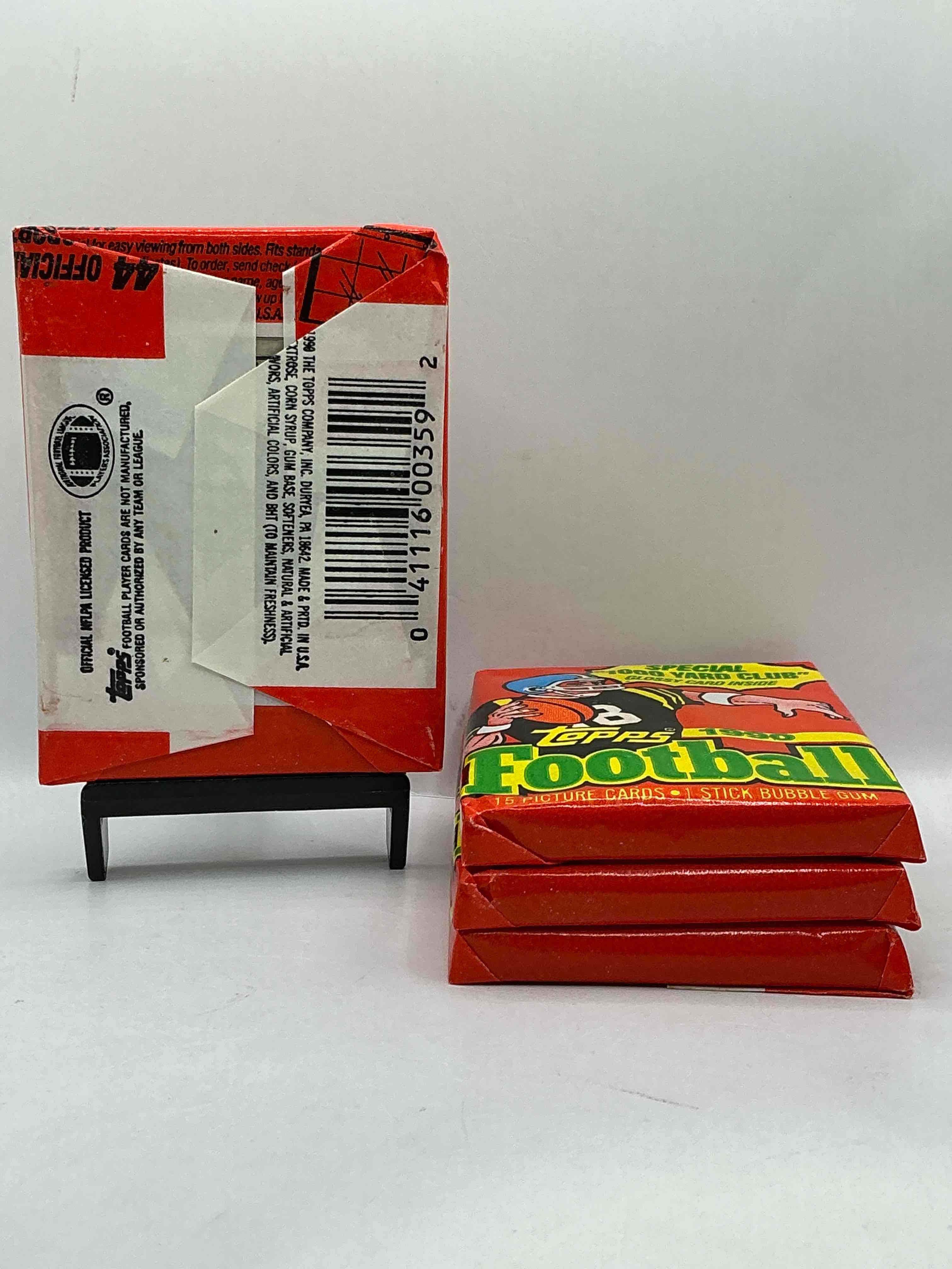 Condition photo showing New/Like New for The Last Year Of Football Wax! Joe Montana, Emmitt Smith & Barry Sanders!? 1990 Topps Football Unopened Sports Card Wax Pack, Direct From Original Retail Box! Getting Hard To Find! Search For Early Barry Sanders & Jerry Rice & So Much More!