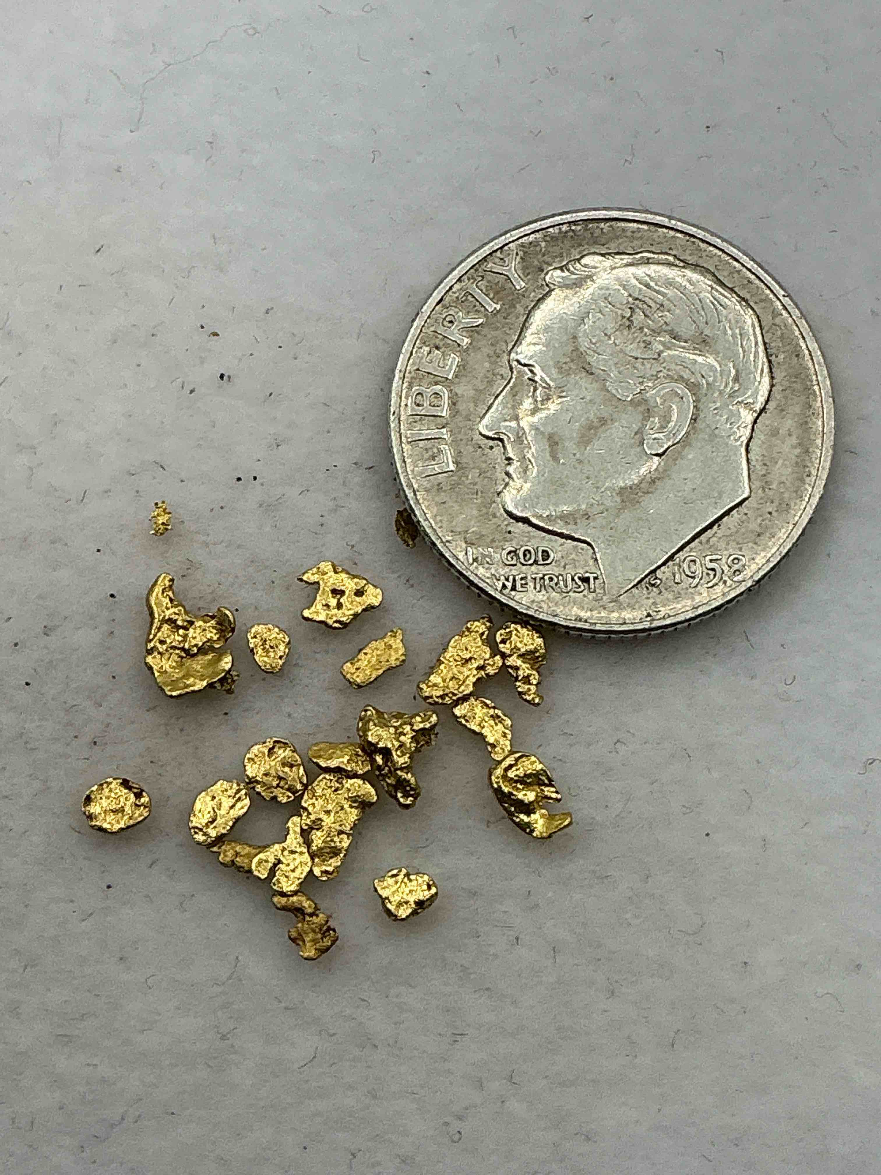 Condition photo showing New/Like New for Genuine Gold Nuggets! Gold Nuggets Fresh From Prospecting North Carolina Mountains, Total Weight Of All Nuggets Is Approximately .5 Grams. These Gold Nuggets Typically Test At Between Approx 22-24 Karat. Gold In Raw, Prospected Form Is Extremely Hard To Find & Much Rarer Than Any Refined Form. Get In On The Gold Craze... Gold Has Increased In Value Over 40% Since 2025! U.S. Dime For Size Reference Only (not included). Gold Vile In Image Included. Own Genuine, Gold Nuggets!