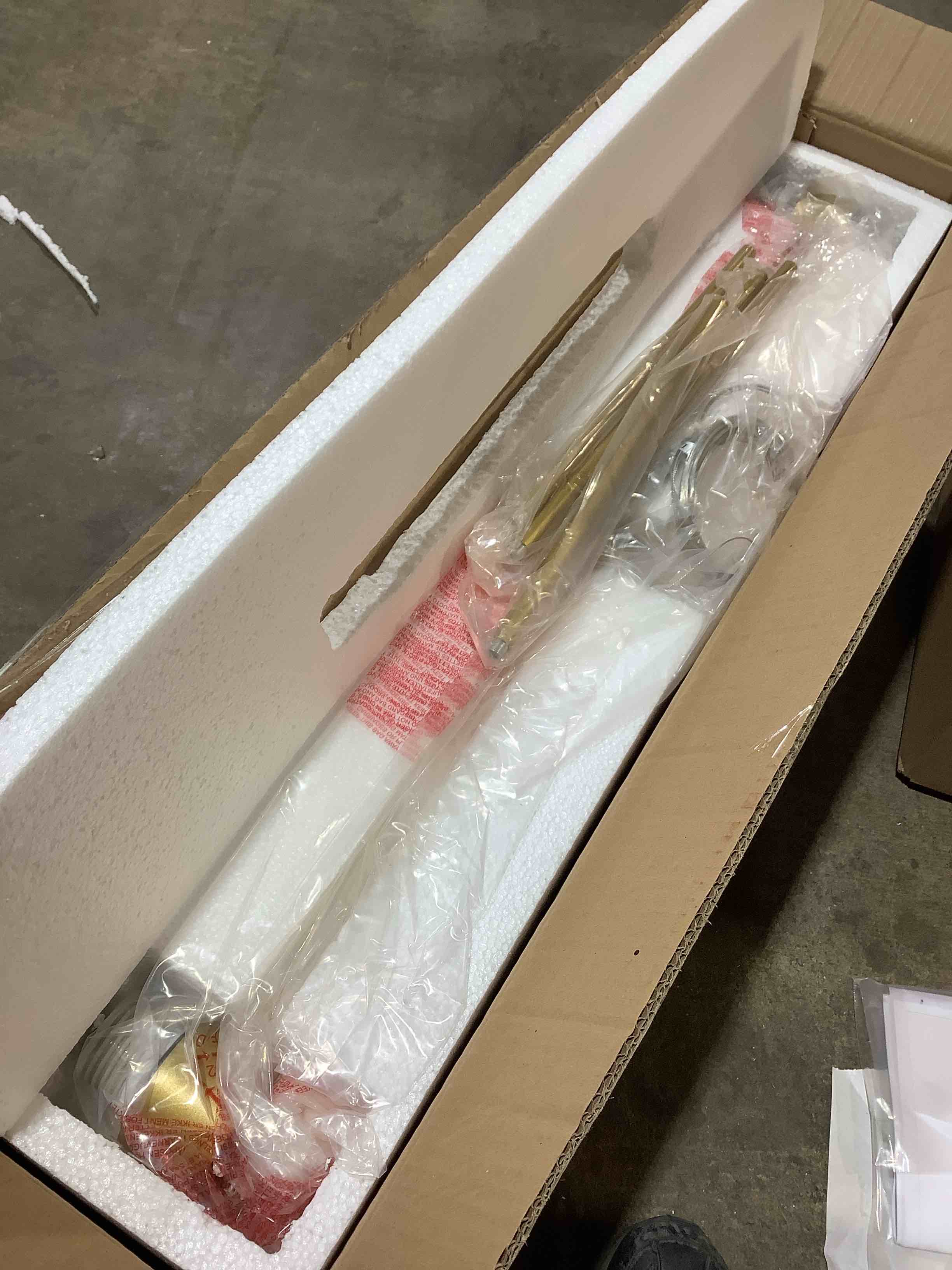 Condition photo showing New/Like New for carthage 4-light modern linear chandelier