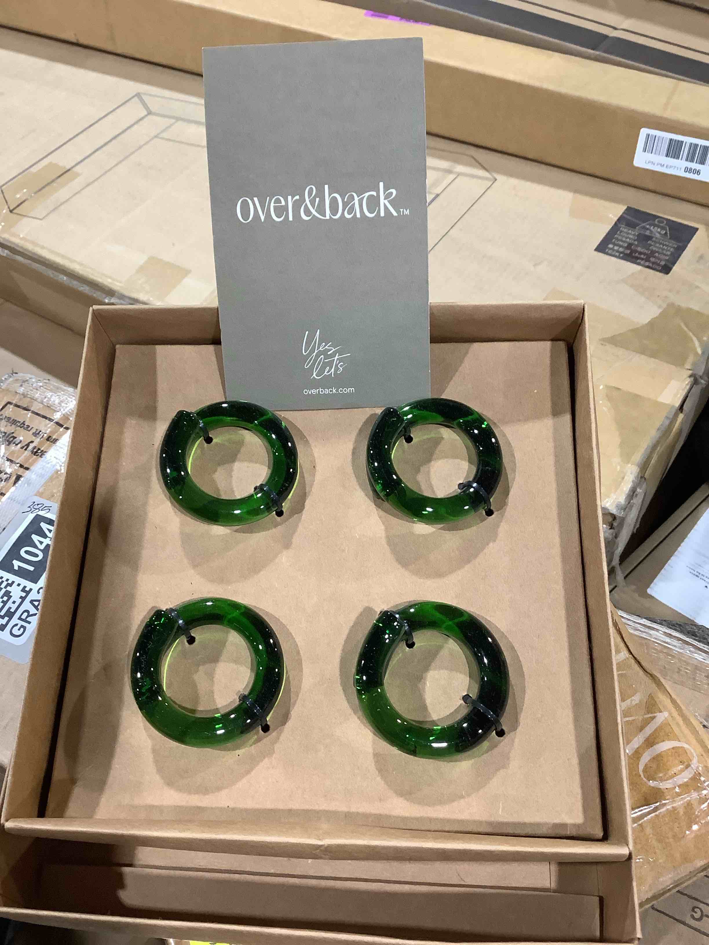 Condition photo showing New/Like New for over & back green hand - shaped glass napkin rings - decorative dining table