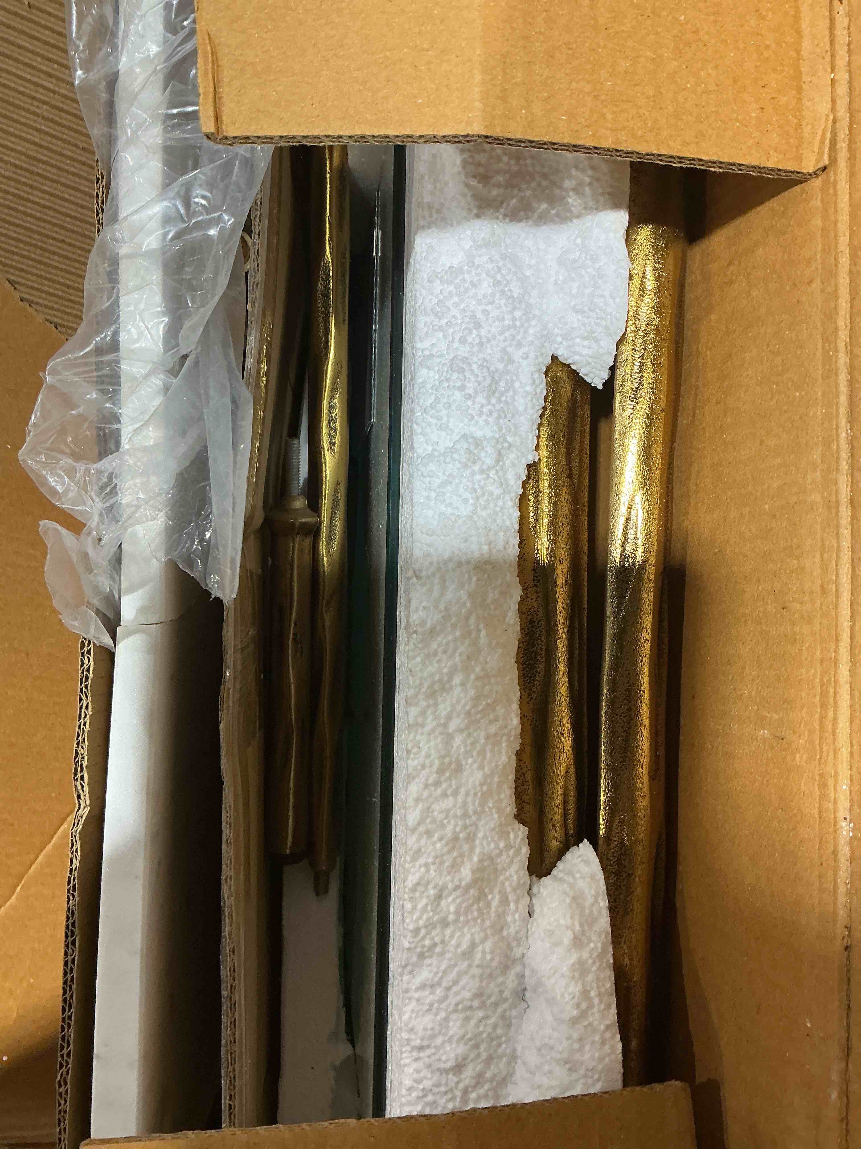 Condition photo showing As Is for signature design by ashley ryandale square accent table for living room, sand?casted aluminum frame with brass finish, glass top and white marble shelf, 21" size