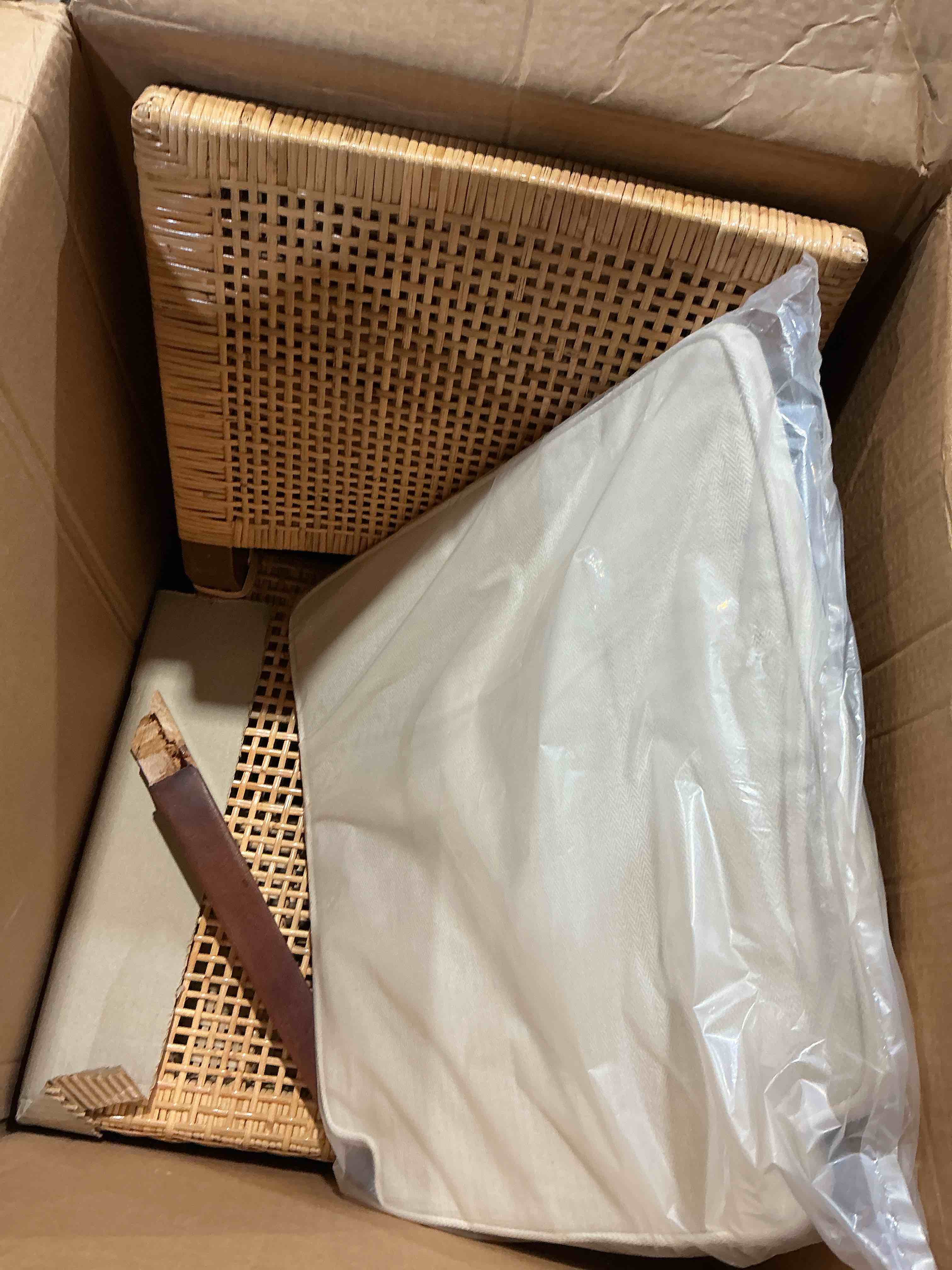 Condition photo showing As Is for baxton studio lesia modern brown rattan and brown wood 1- piece dining chair