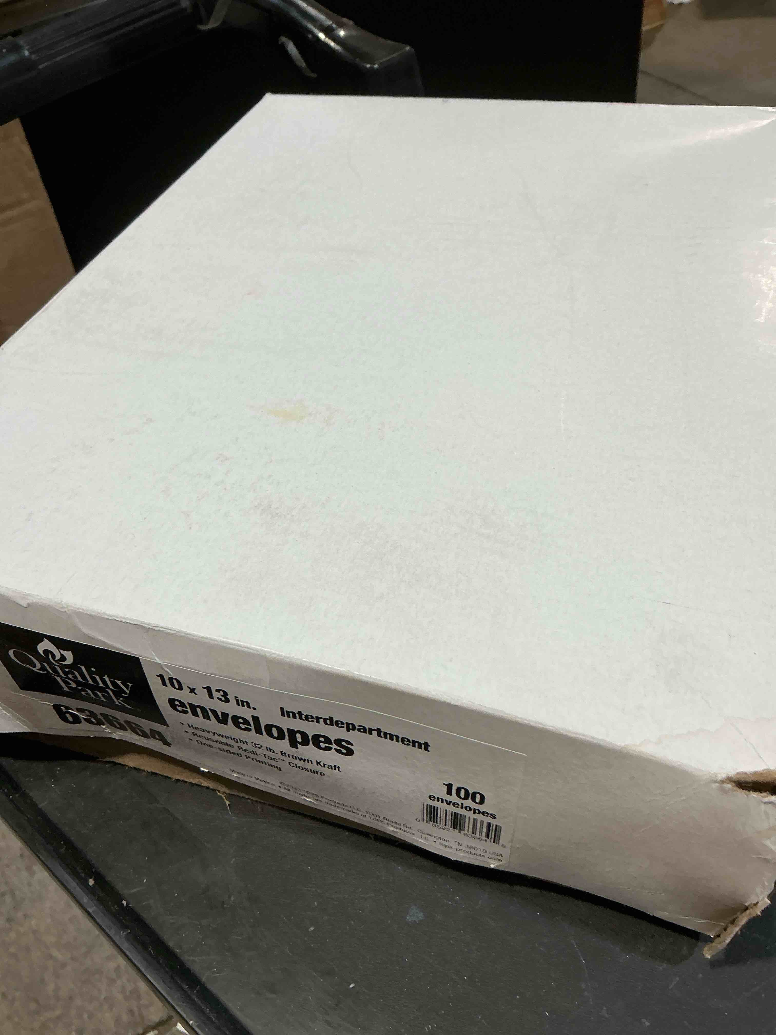 Condition photo showing New/Like New for quality park 10 x 13 interoffice envelopes, with reusable redi-tac self seal closure, for interoffice mail, heavyweight 32 lb brown kraft, 100 per box