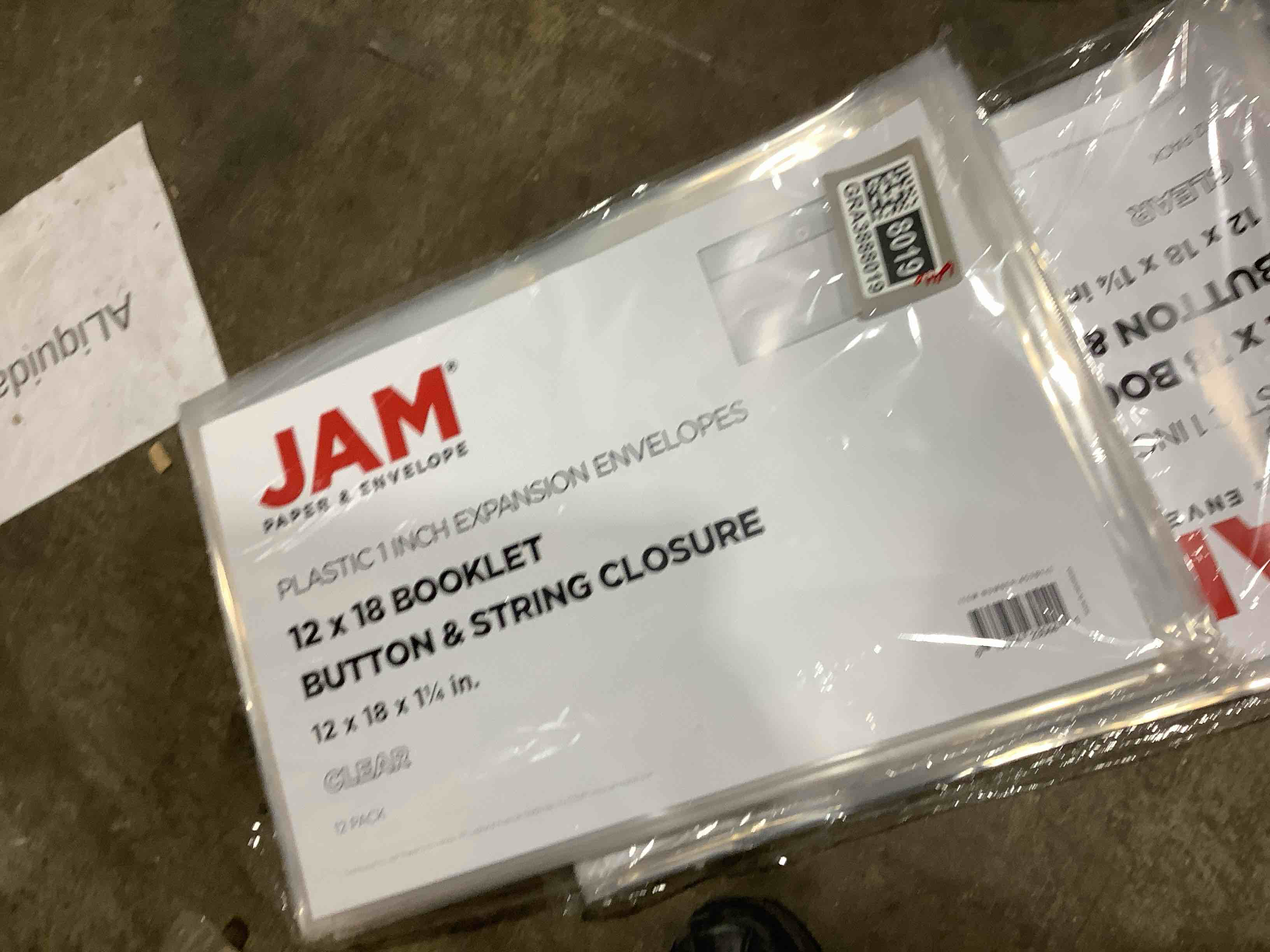 Condition photo showing New/Like New for jam paper plastic envelopes 12 x 18 clear 12/pack button string booklet