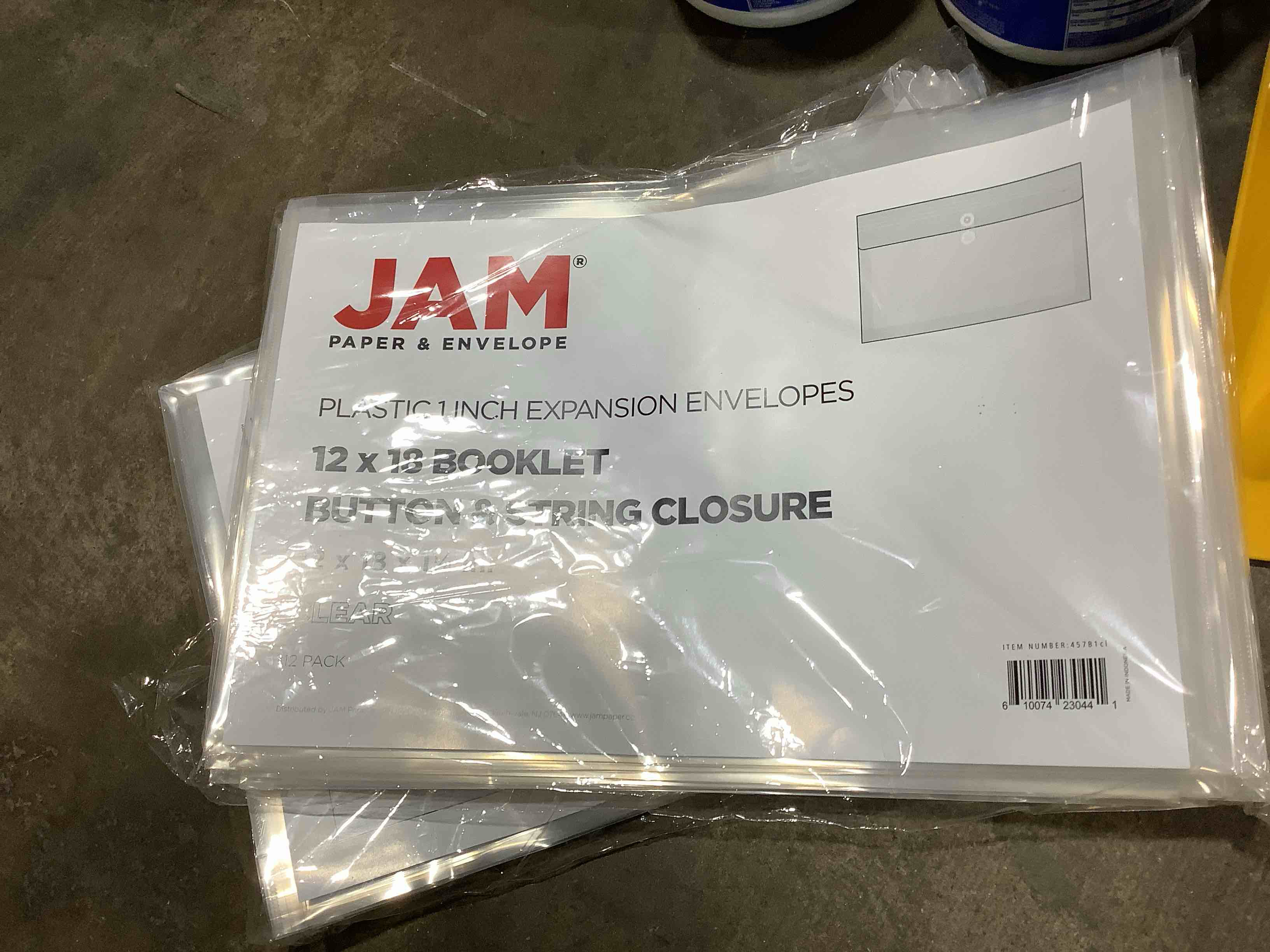 Condition photo showing New/Like New for jam paper plastic envelopes 12 x 18 clear 12/pack button string booklet