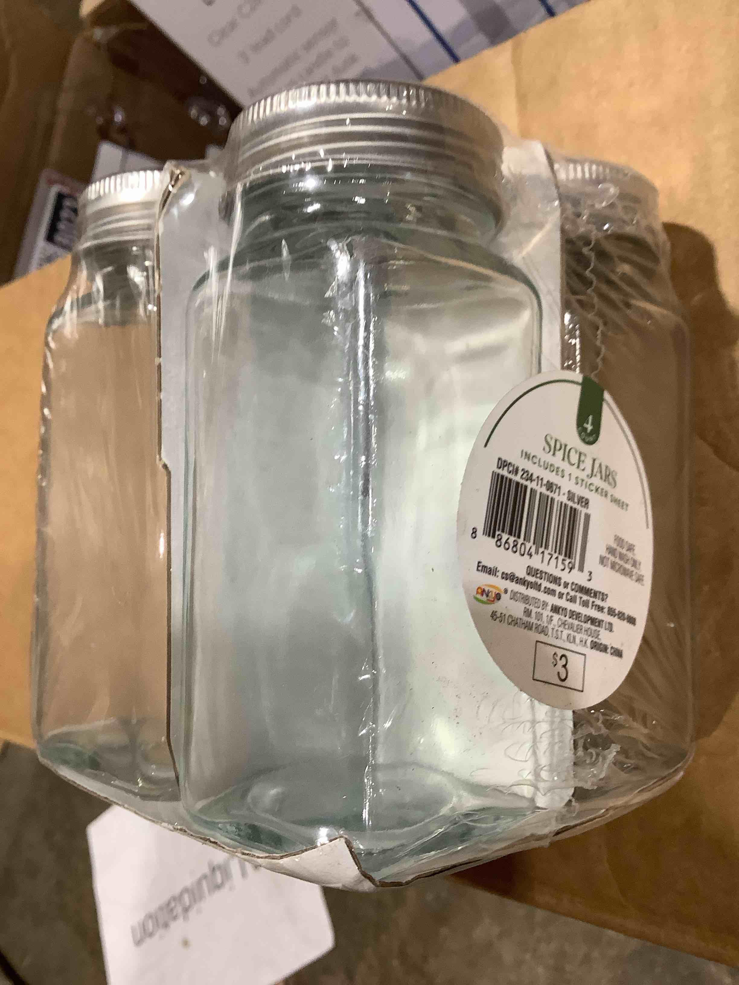 Condition photo showing New/Like New for spice jars with 1 sticker sheet, black lids, food safe, 4 jars