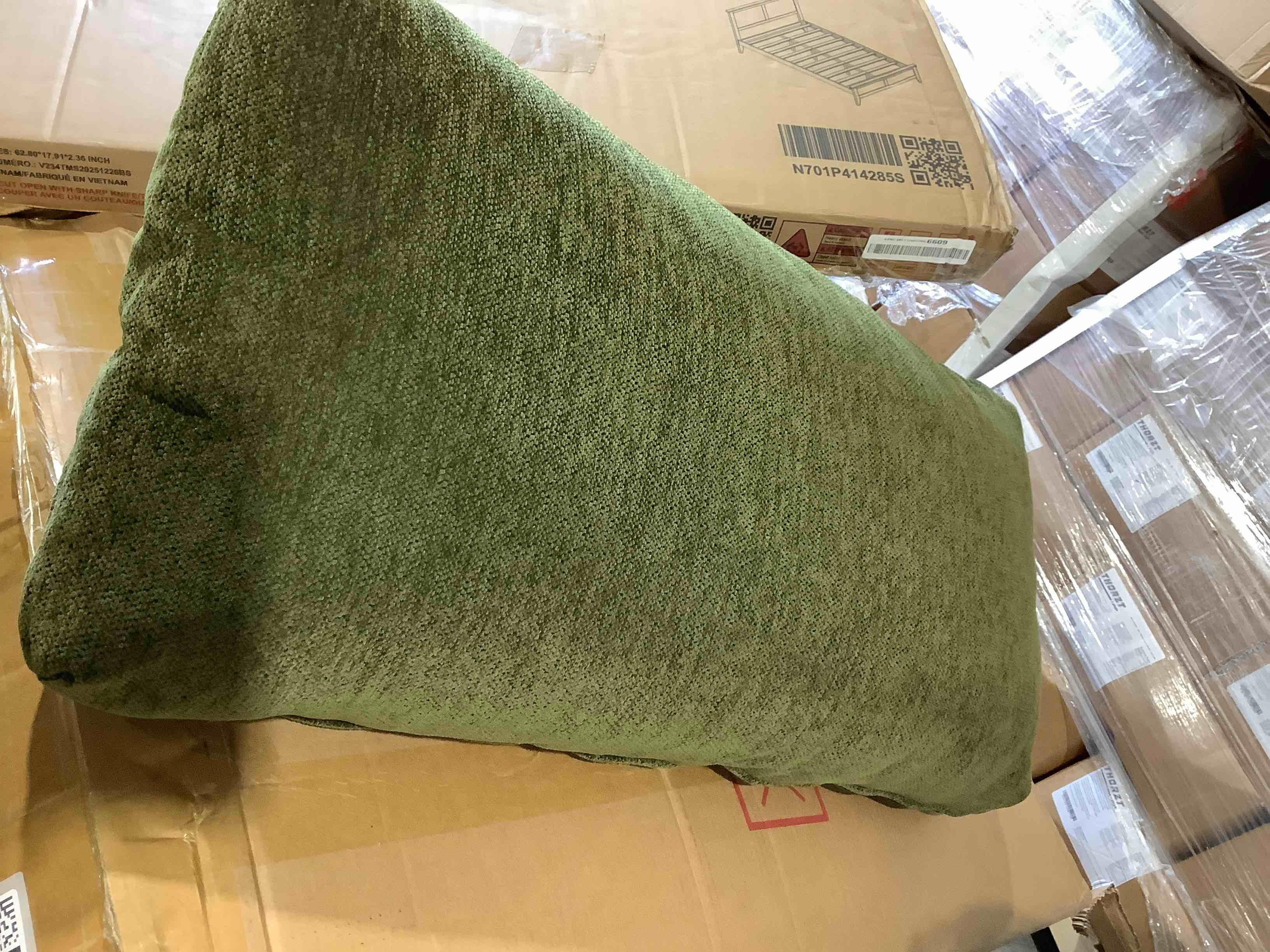 Condition photo showing New/Like New for 34" forest green upholstery pillow