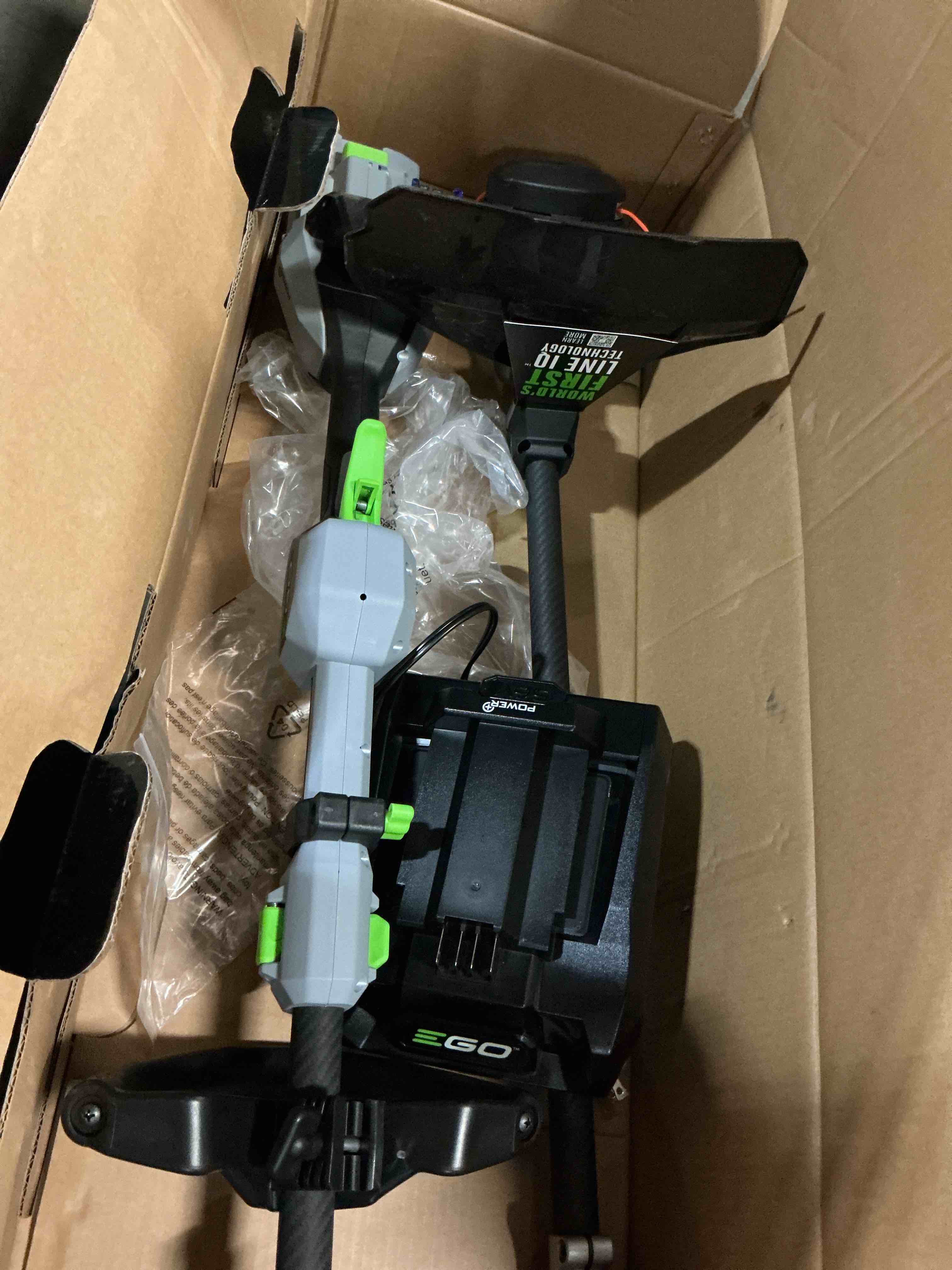 Condition photo showing As Is for ego power+ string trimmer kit 16  line iq with powerload