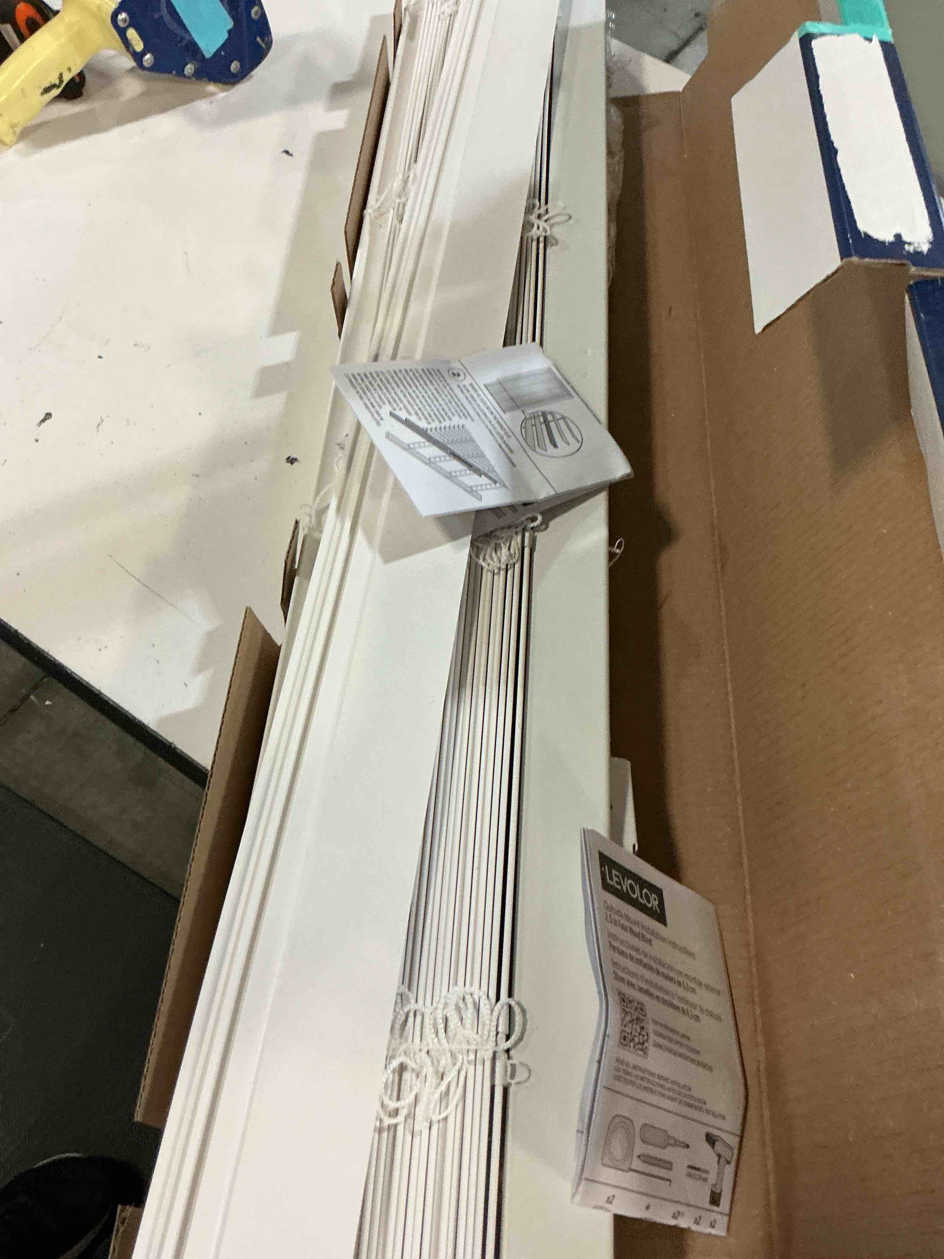 Condition photo showing As Is for levolor trim+go 2.5-in slat width 43-in x 72-in cordless white faux wood room darkening horizontal blinds