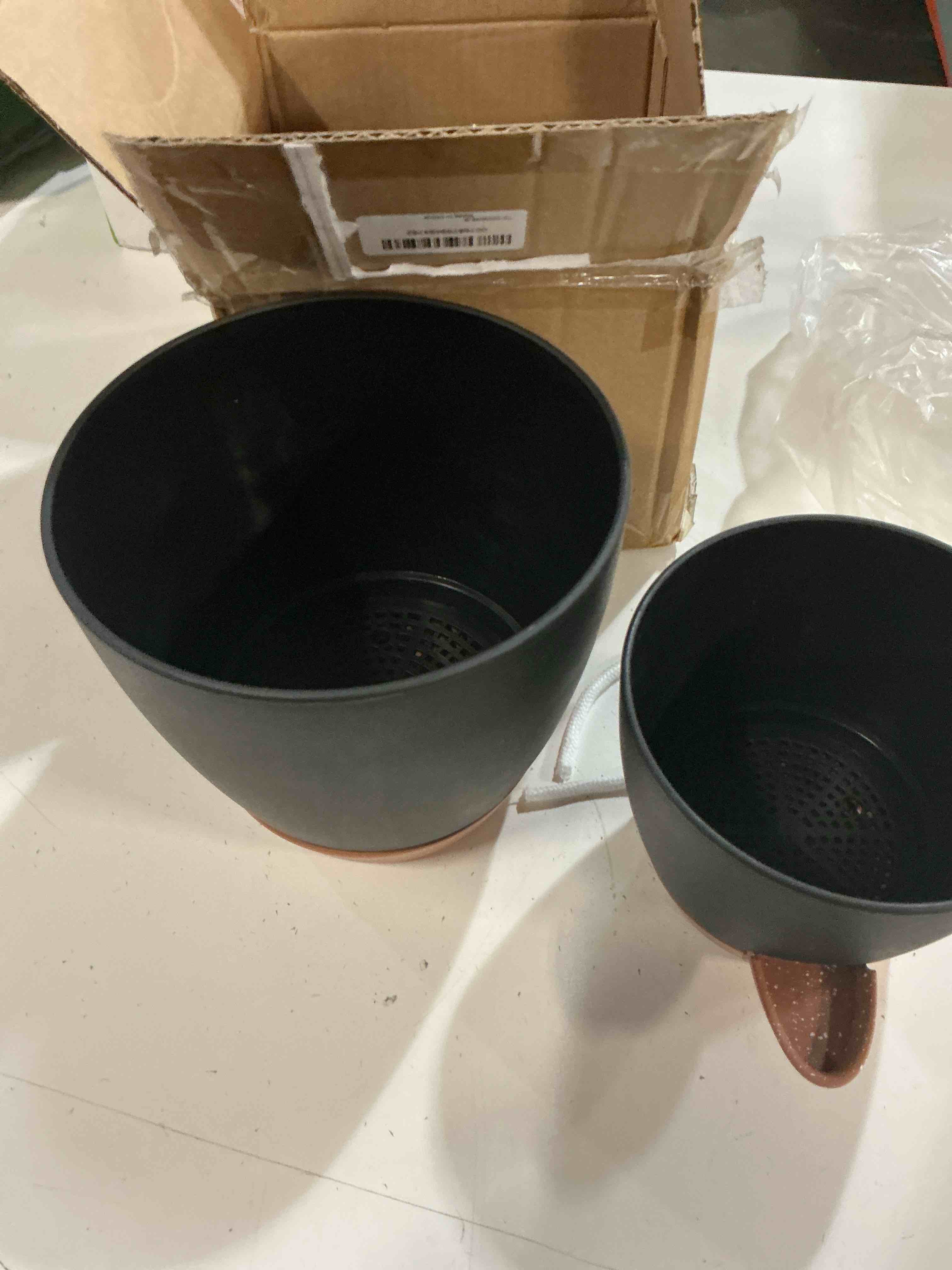 Condition photo showing As Is for black plastic self watering plant pots with multi mesh drainage holes for garden plants (3-pack) (missing parts)
