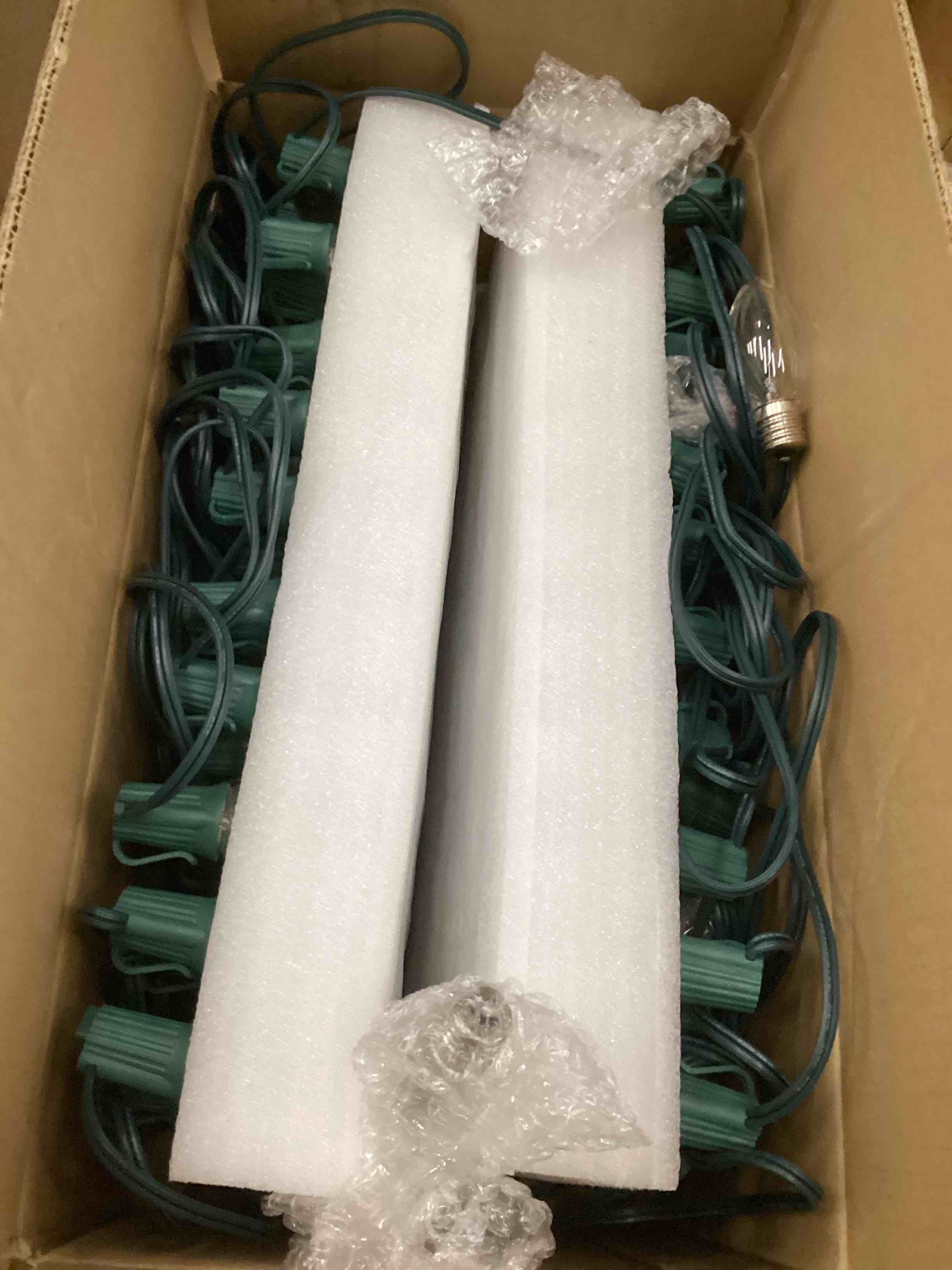 Condition photo showing Good Condition for C9 Clear Christmas String Lights, 100 Feet Waterproof Vintage Christmas Tree Lights, Outdoor Roofline String Lights with 100 Clear Bulbs for Patio Garden Holiday Indoor Home Decoration, Green Wire 100FT Clear Bulb Green Wire