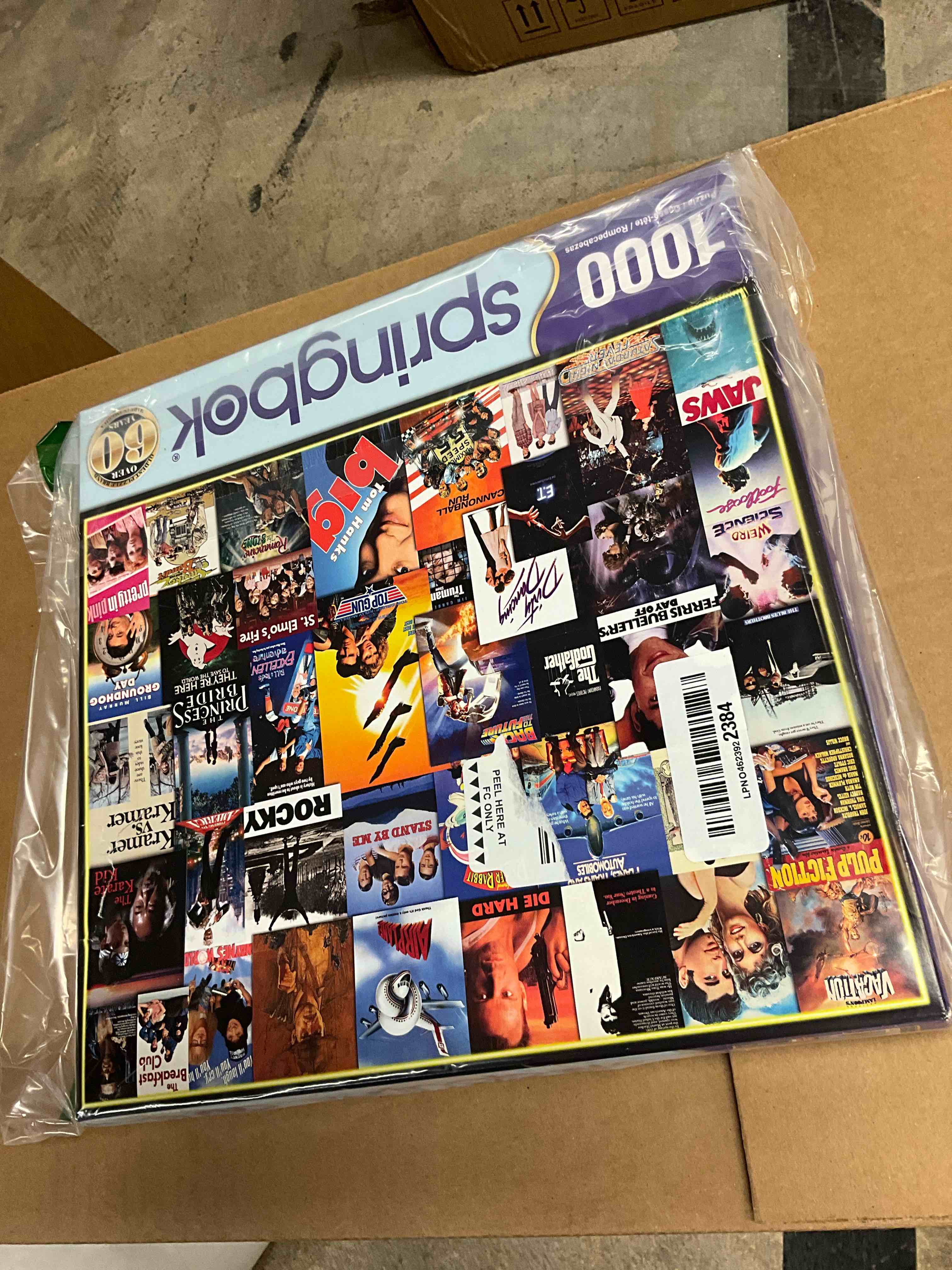 Condition photo showing New/Like New for Springbok Going to The Movies 1000 Piece Jigsaw Puzzle for Adults Features a Photo Collage of Posters from Some of America's Favorite Films Multi