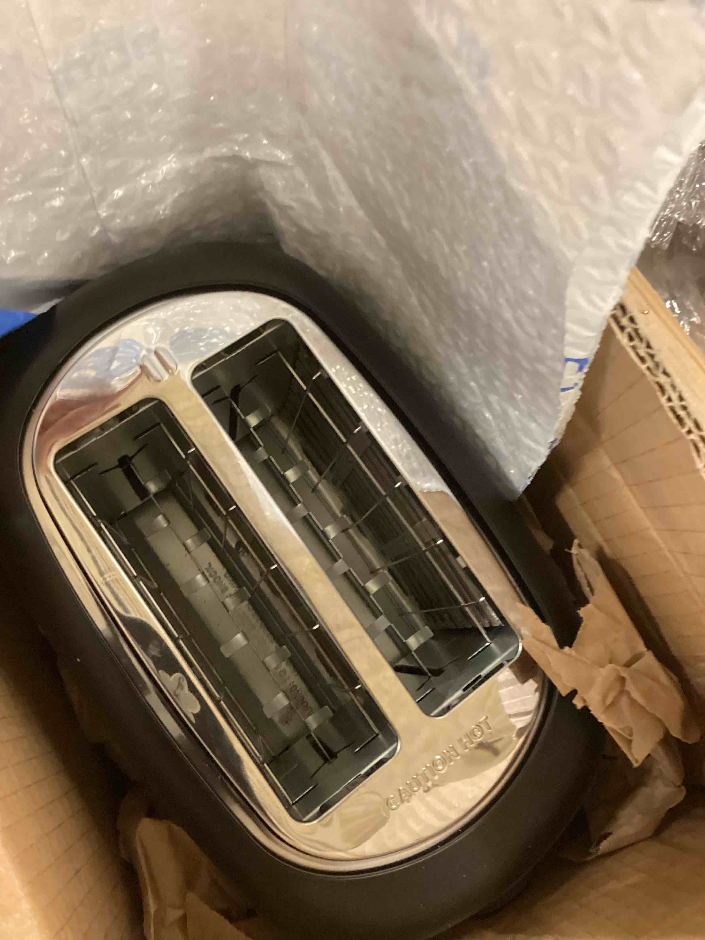 Condition photo showing As Is for Amazon Basics 2 Slice Toaster, With 6 Browning Settings, Extra Wide Slots For Bagels and Special Breads, Removable Easy-to-Clean Crumb Tray, Cancel/Defrost/Bagel Buttons, 900W, Black & Silver 2 Slice Silver Front