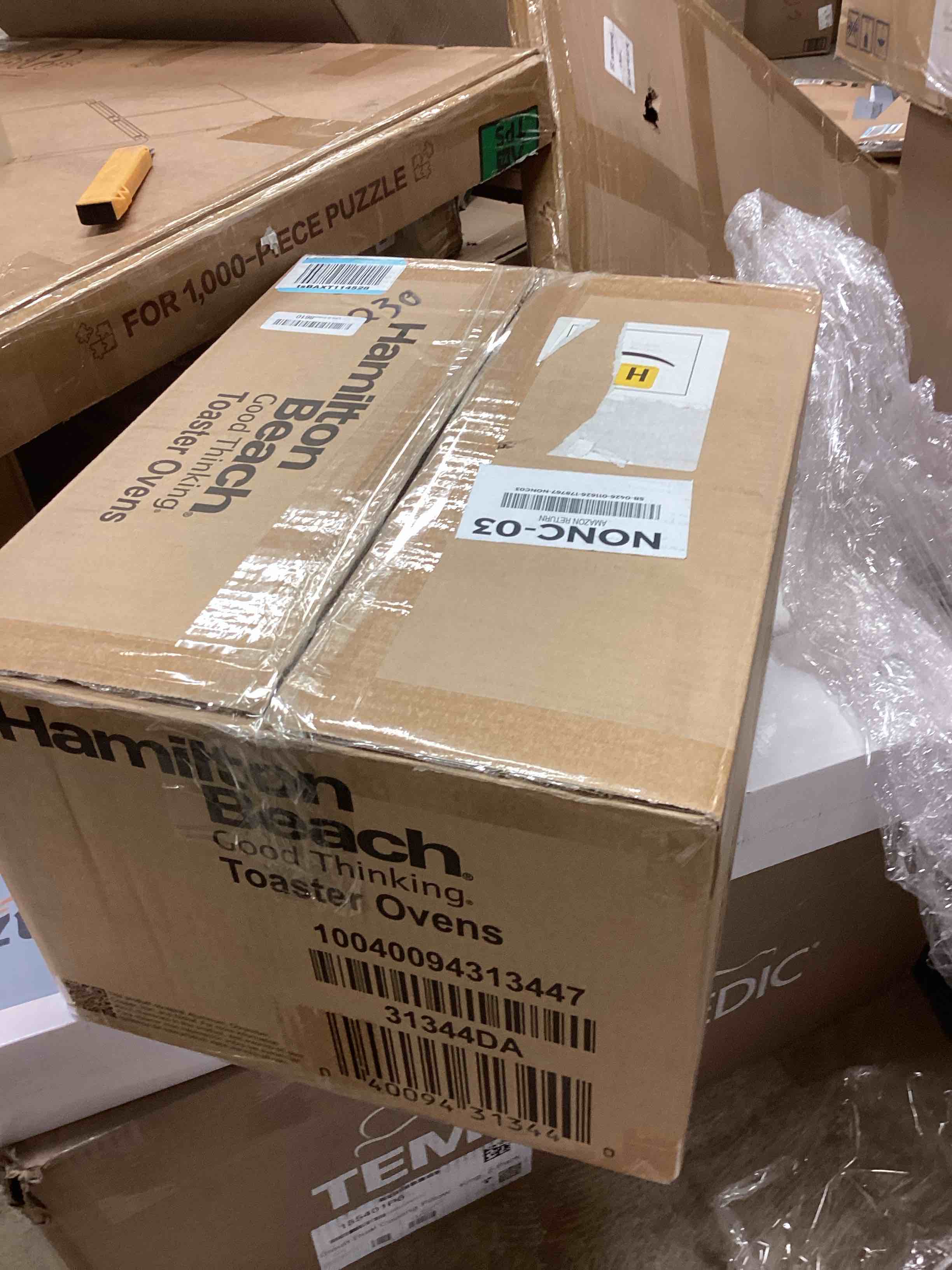 Condition photo showing New/Like New for Hamilton Beach Easy Reach 4-Slice Countertop Toaster Oven With Roll-Top Door, 1200 Watts, Fits 9” Pizza, 3 Cooking Functions for Bake, Broil and Toast, Silver (31344DA) Silver 4-Slice