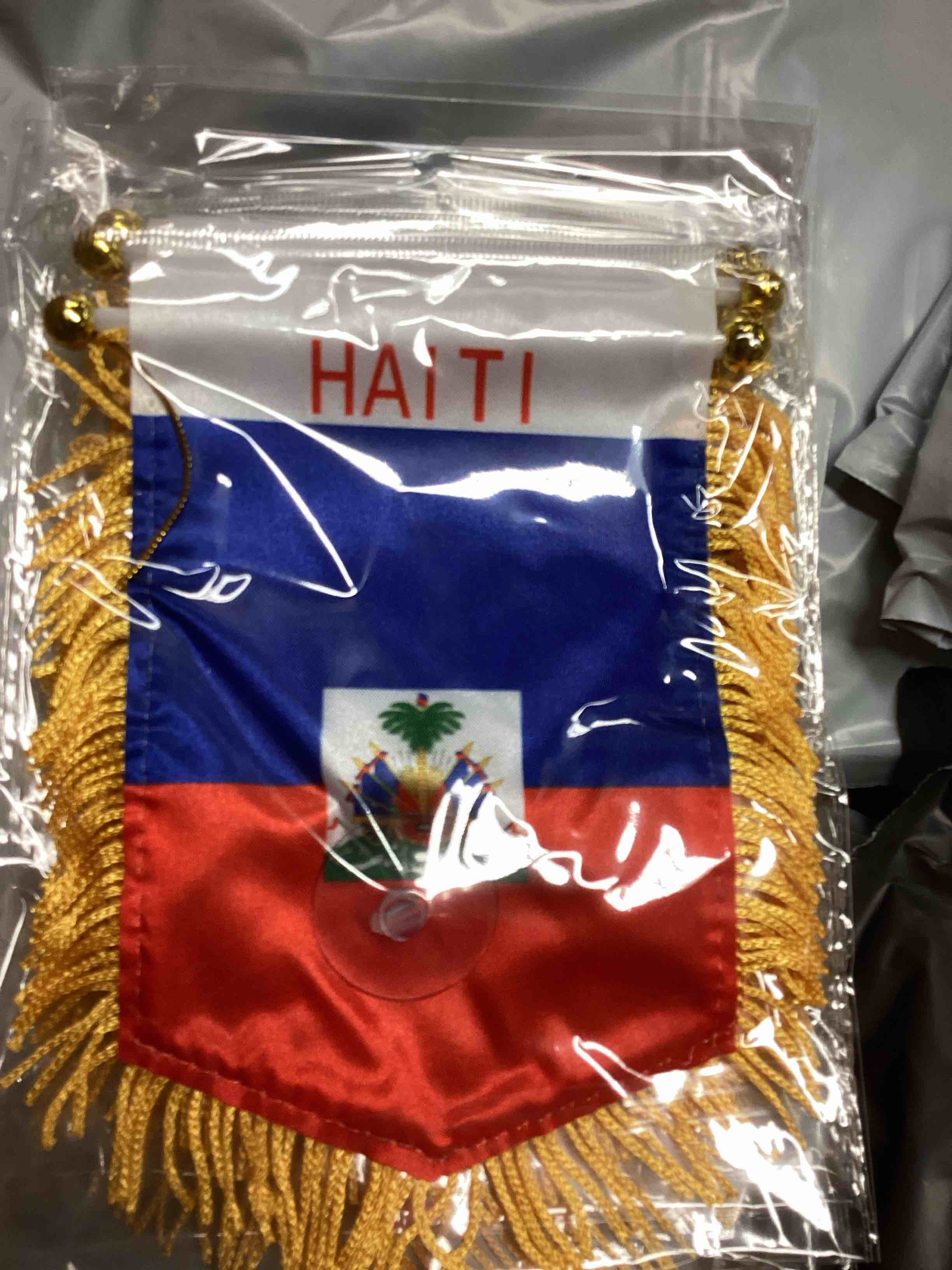 Condition photo showing New/Like New for (Case of 38 packs of 5 pcs) Anley 4 X 6 Inch Haiti Fringy Window Hanging Flag - Mini Flag Banner & Car Rearview Mirror Décor - Fringed & Double Sided - Haitian Hanging Flag with Suction Cup