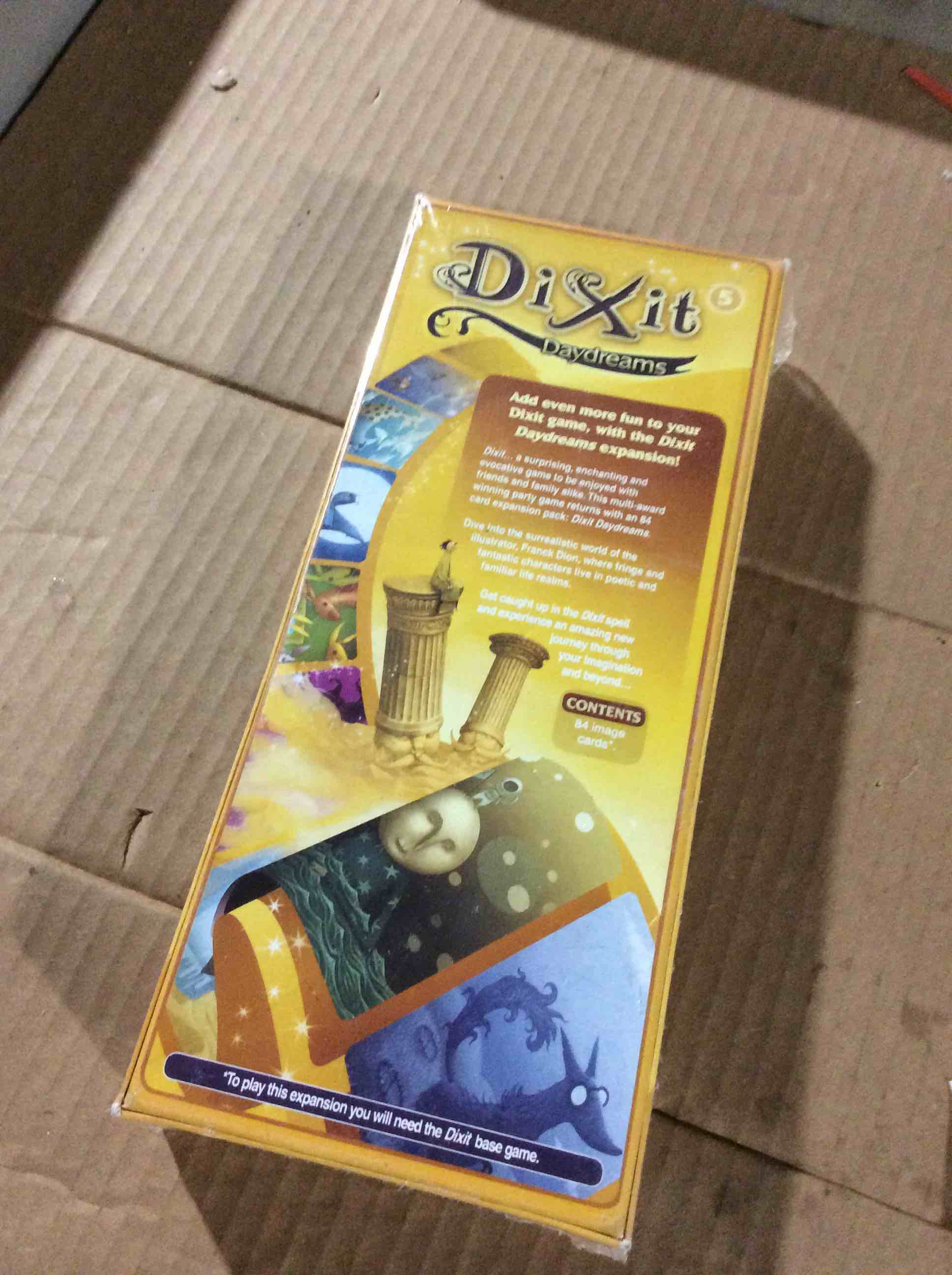 Condition photo showing New/Like New for Dixit Daydreams Board Game EXPANSION - Surreal Artistry with 84 Enigmatic Cards! Creative Storytelling Game, Family Game for Kids & Adults, Ages 8+, 3-6 Players, 30 Min Playtime, Made by Libellud
