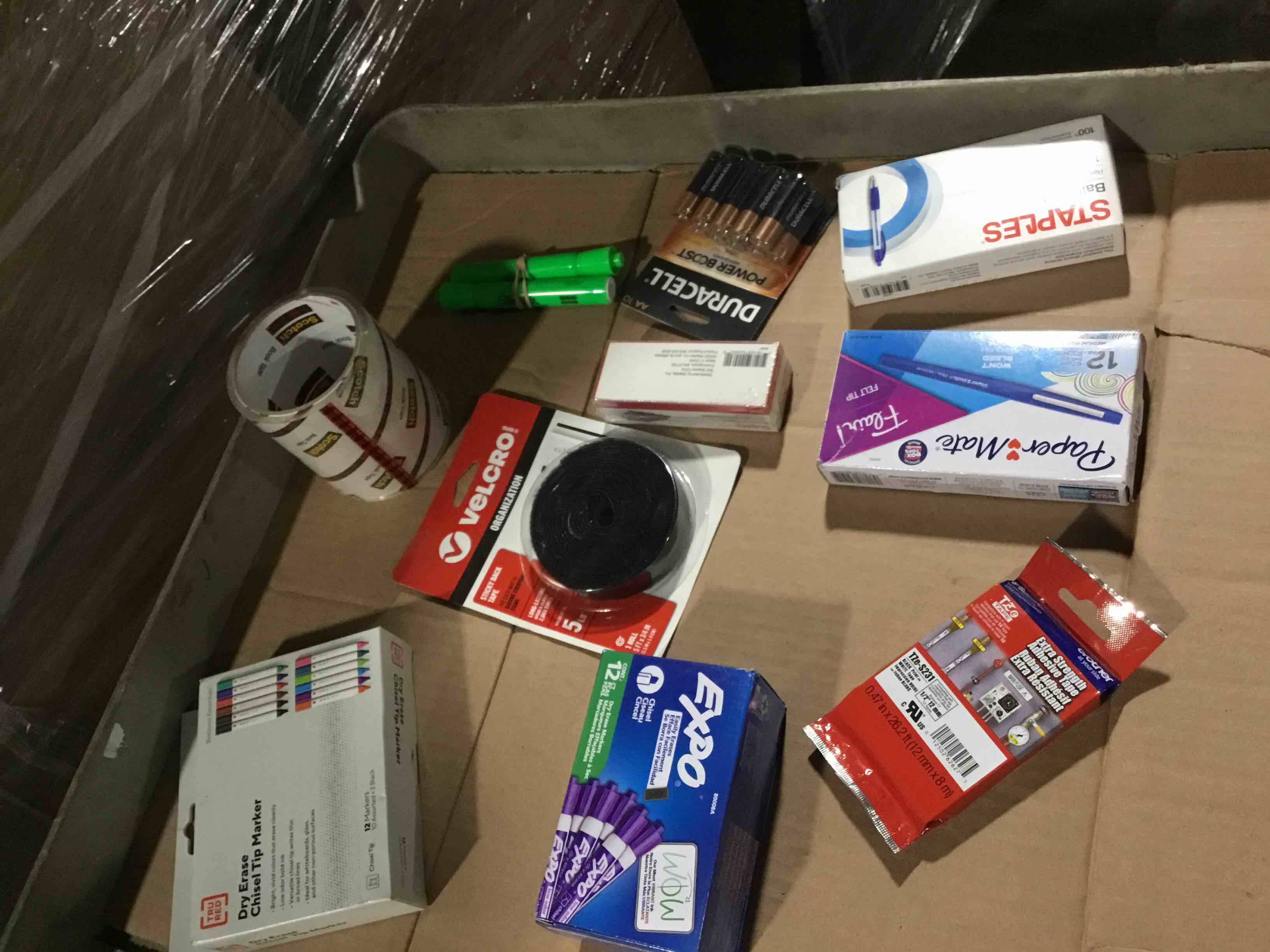 box of assorted office products 