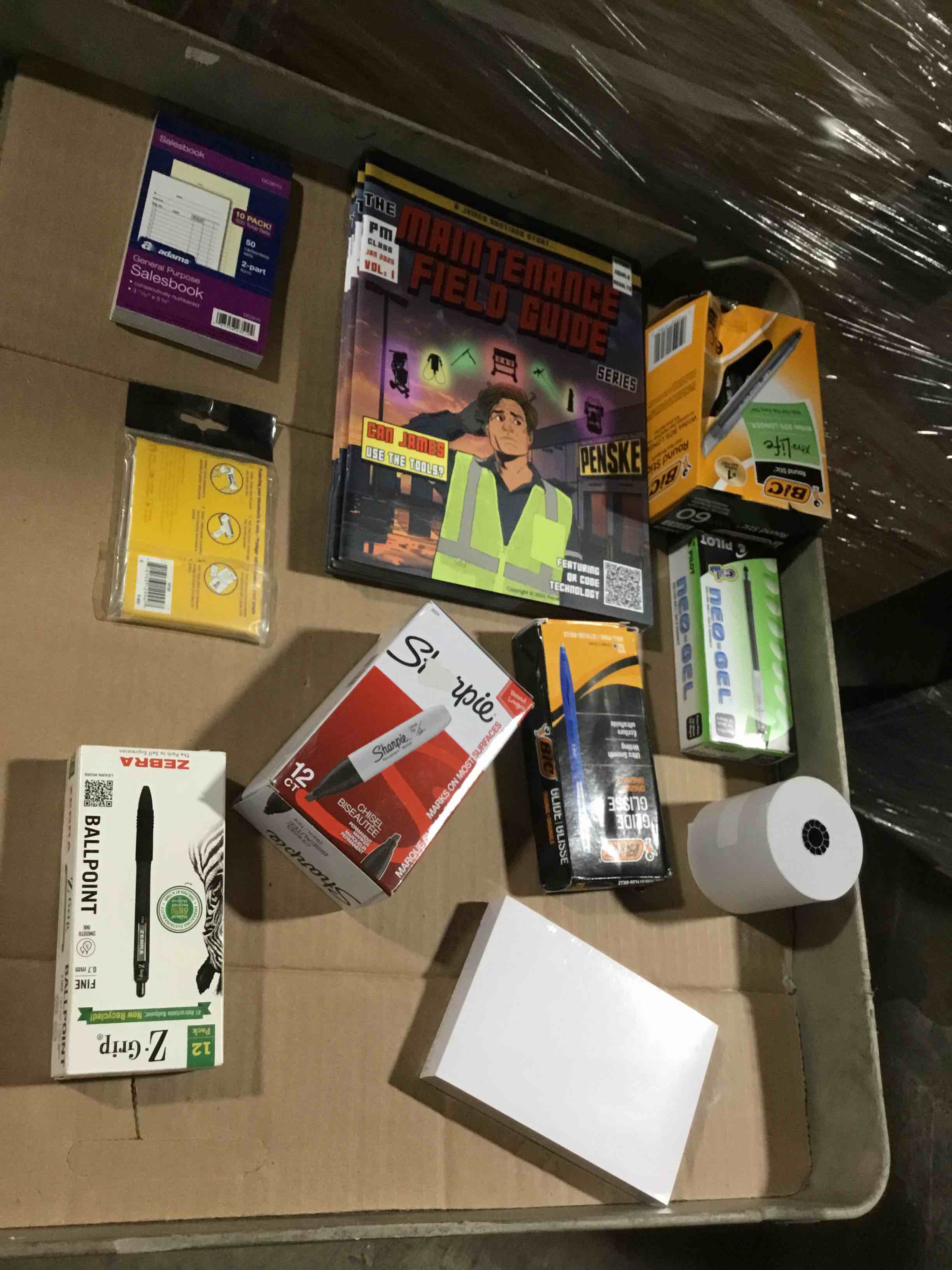 box of assorted office products 