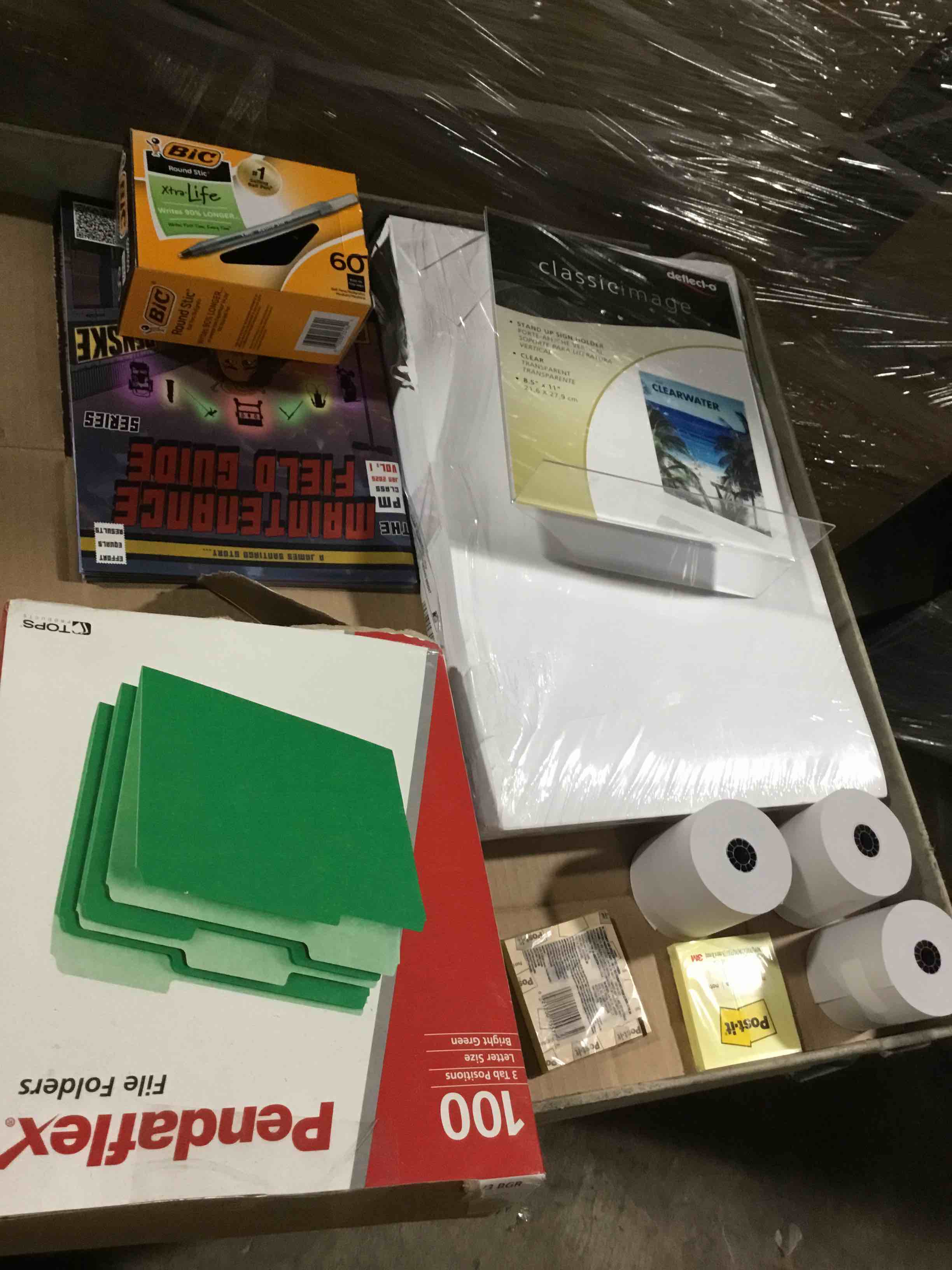 box of assorted office products 