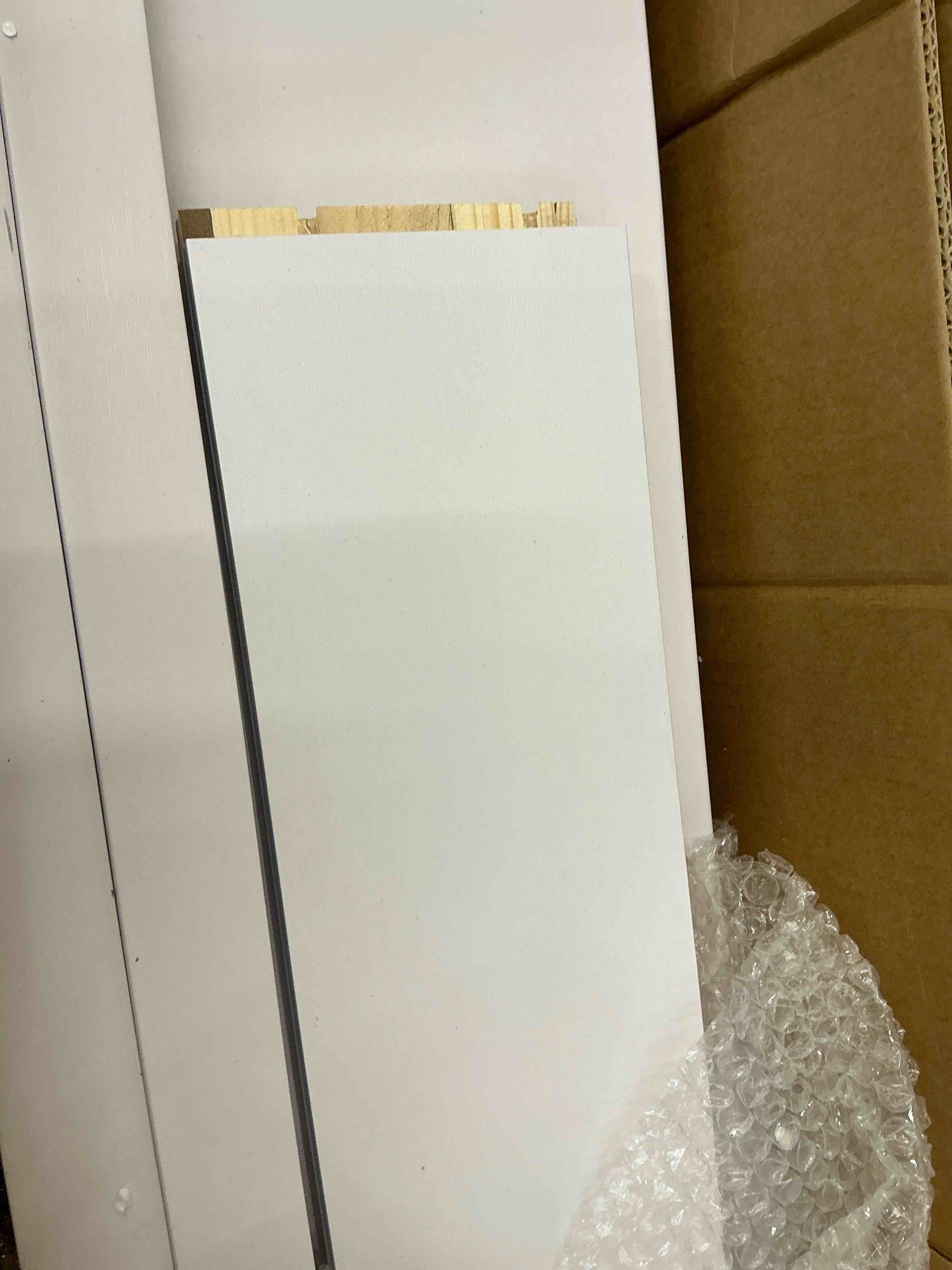 Condition photo showing As Is for smartstandard 40 x 84 inch white sliding mdf barn door with 7ft brushed nickel sliding door hardware kit & handle, pre-drilled ready to assemble, waterproof pvc coating, h-frame (only the edges of the door)