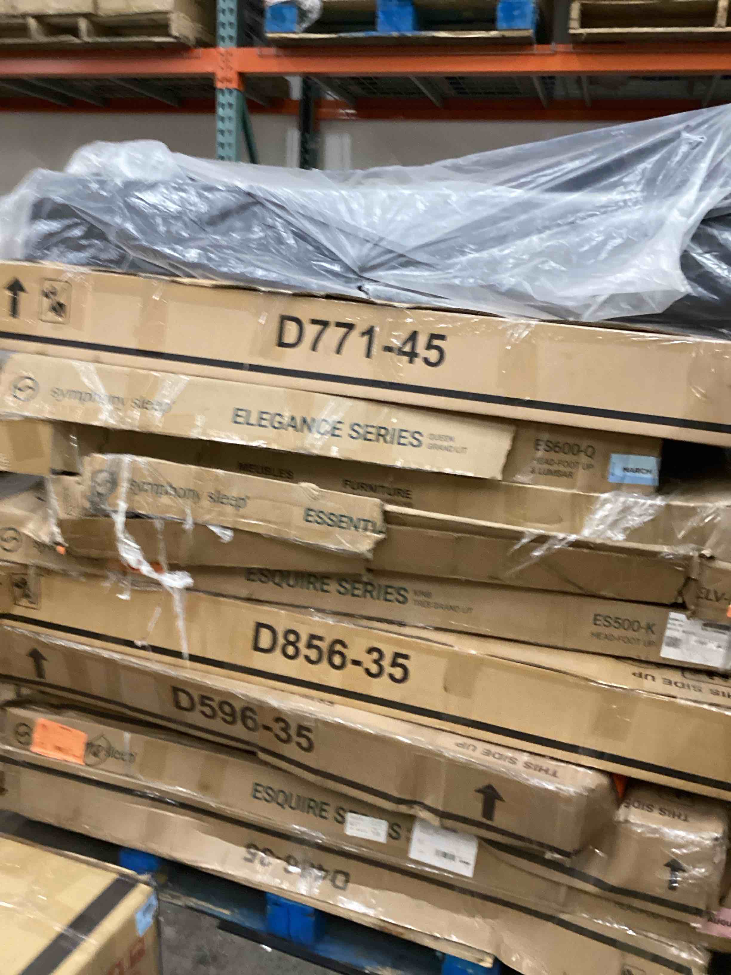 pallet lot of adjustable bed bases and dining table tops 