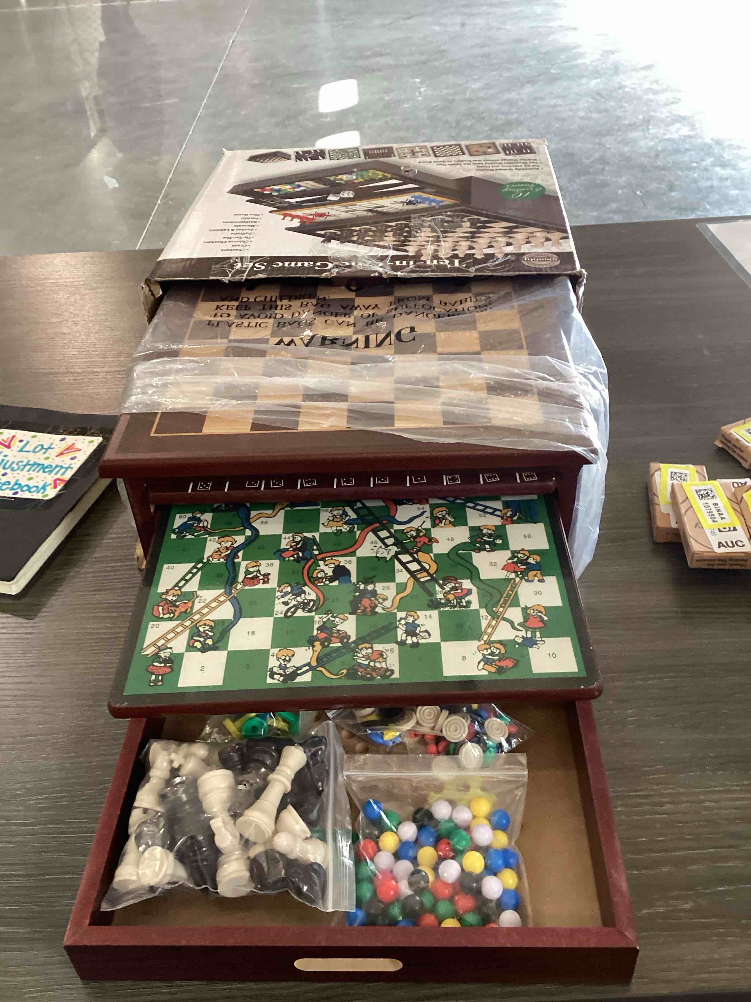 Condition photo showing As Is for Bundaloo 10-in-1 Classic Wooden Board Game Set – Chess, Checkers, Backgammon, and More – Premium Multi-Game Collection with Built-in Storage (10 in 1)