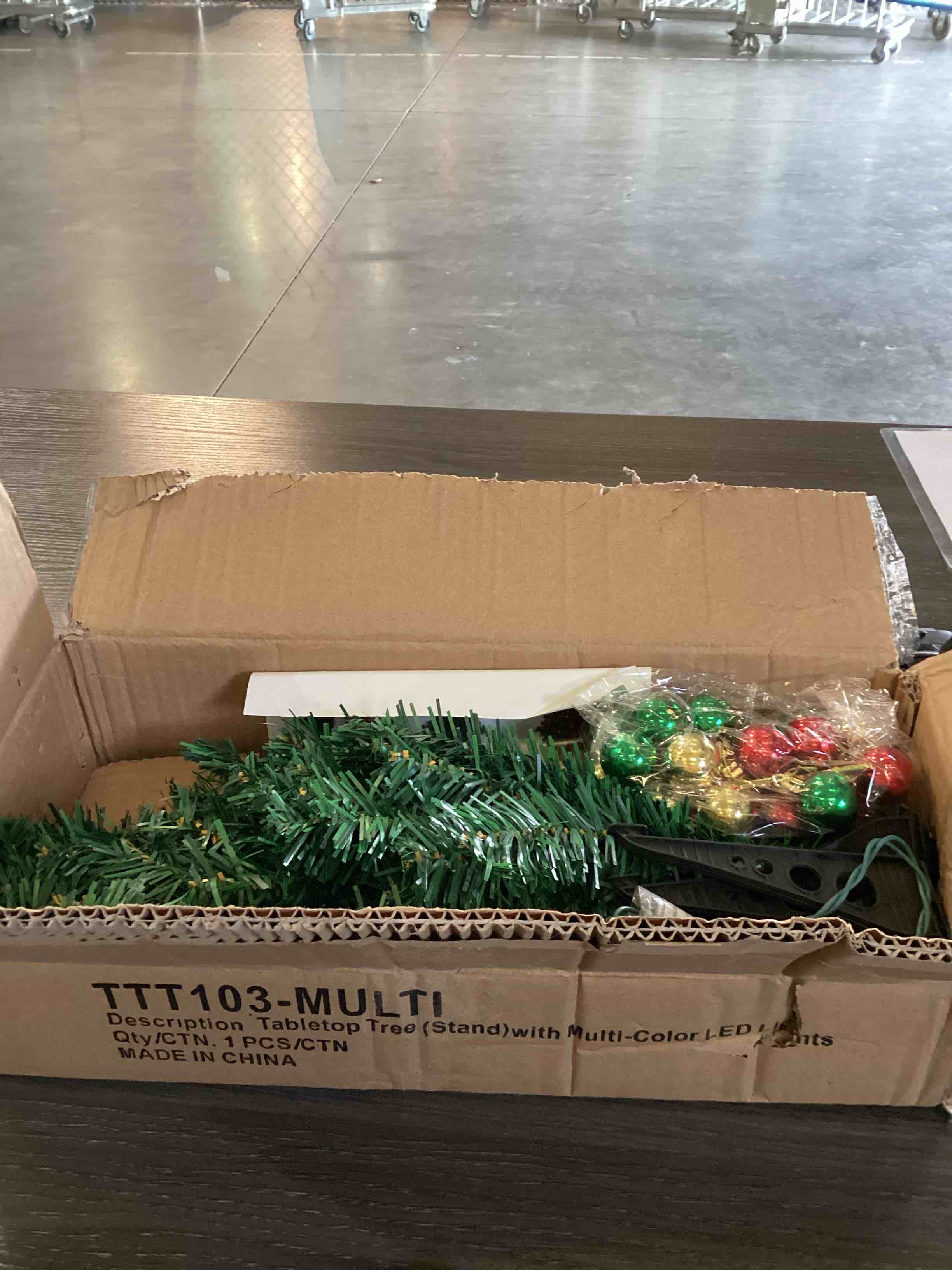 table top Christmas tree with lights and ornaments 