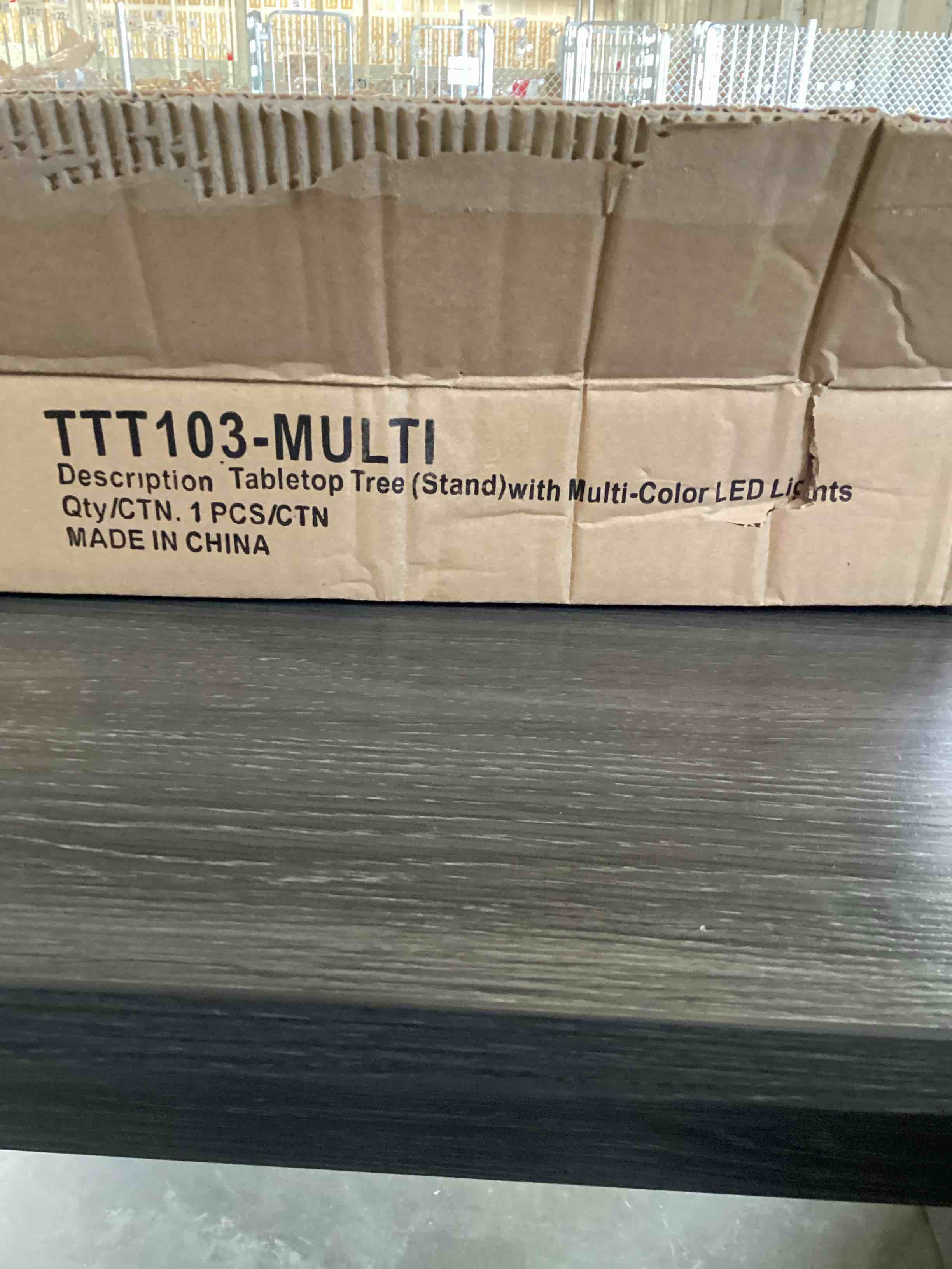 Condition photo showing As Is for table top Christmas tree with lights and ornaments 