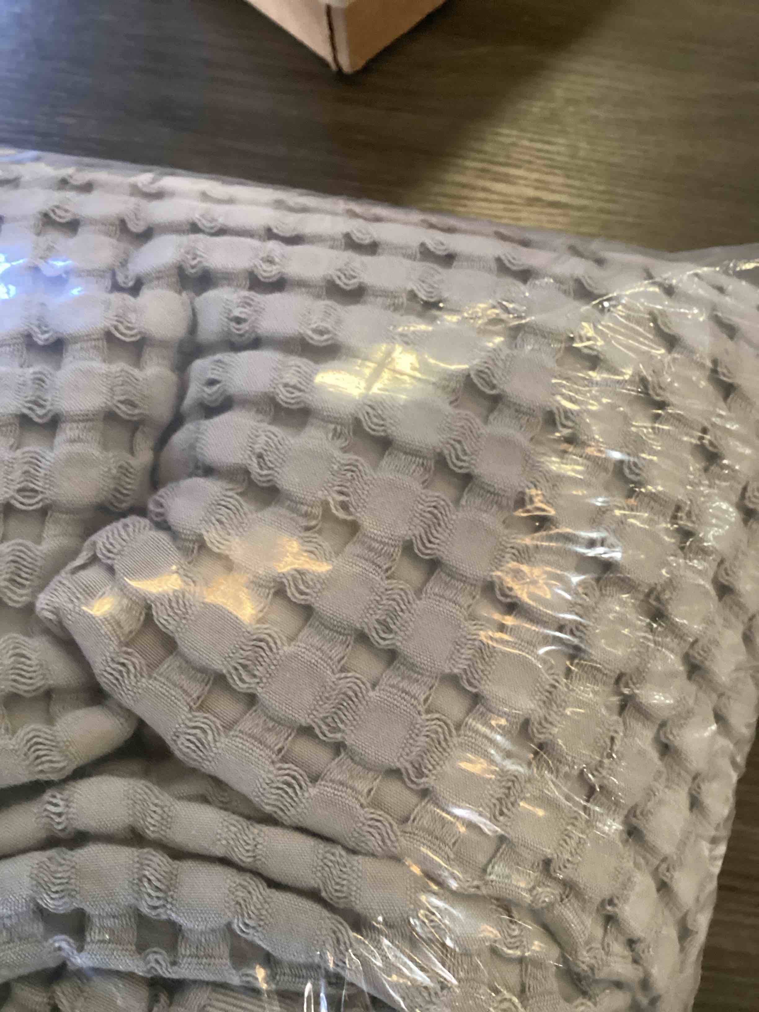 Condition photo showing As Is for grey blanket 