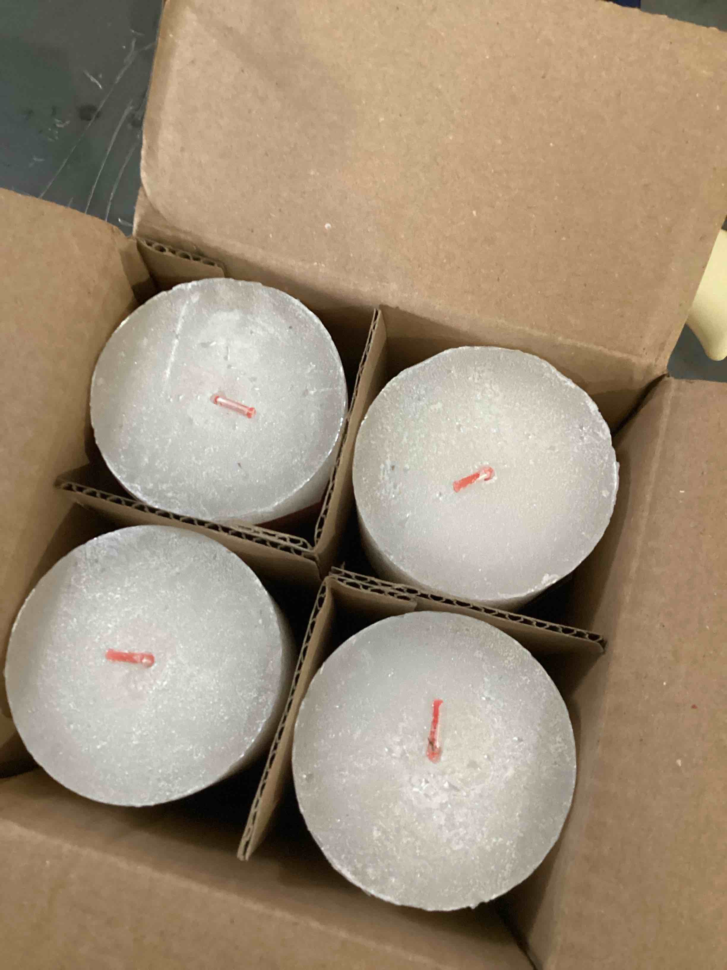 Condition photo showing As Is for 4 white/ivory metallic pillar candles 