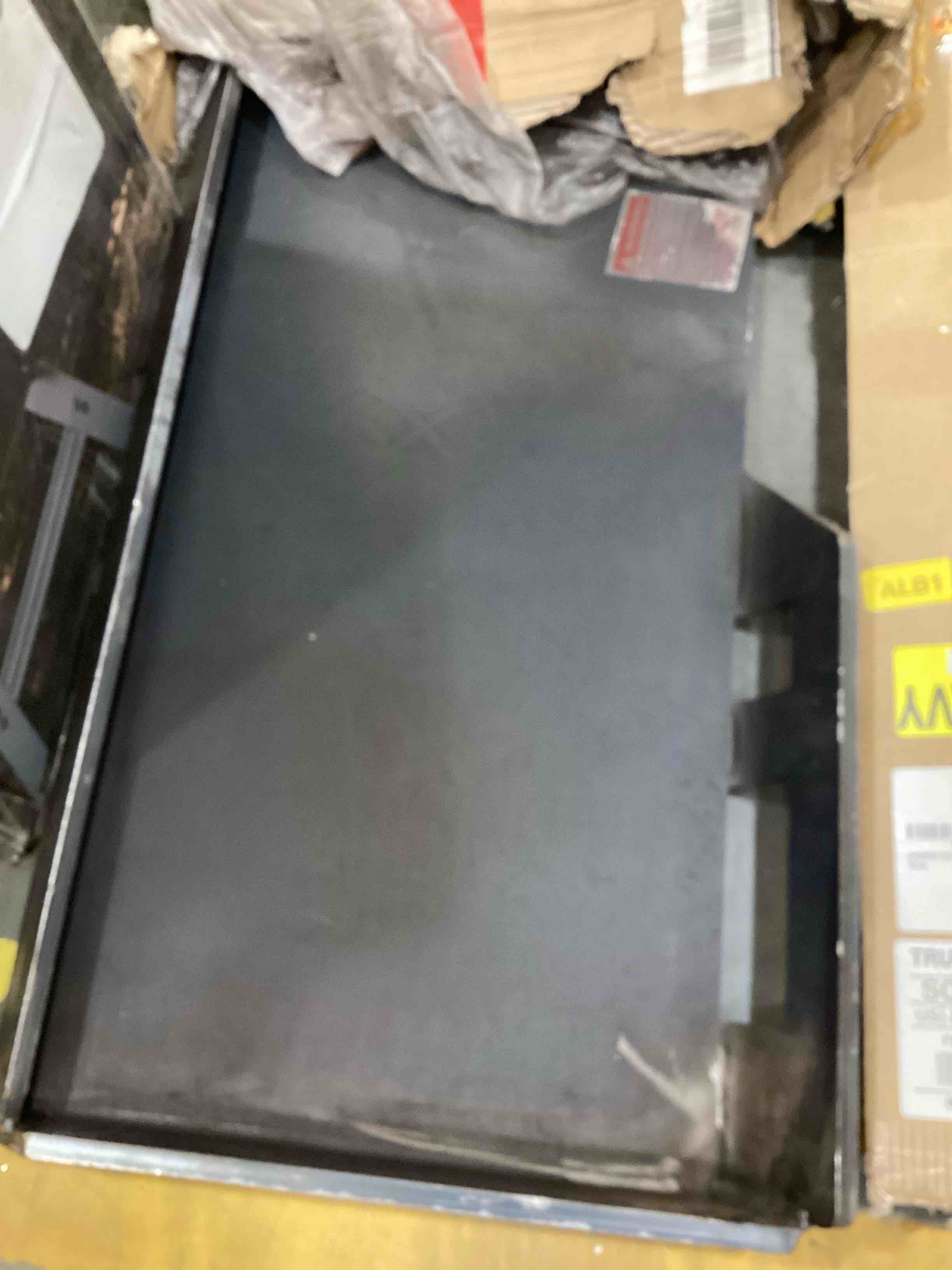 Condition photo showing As Is for skid steer mount plate
