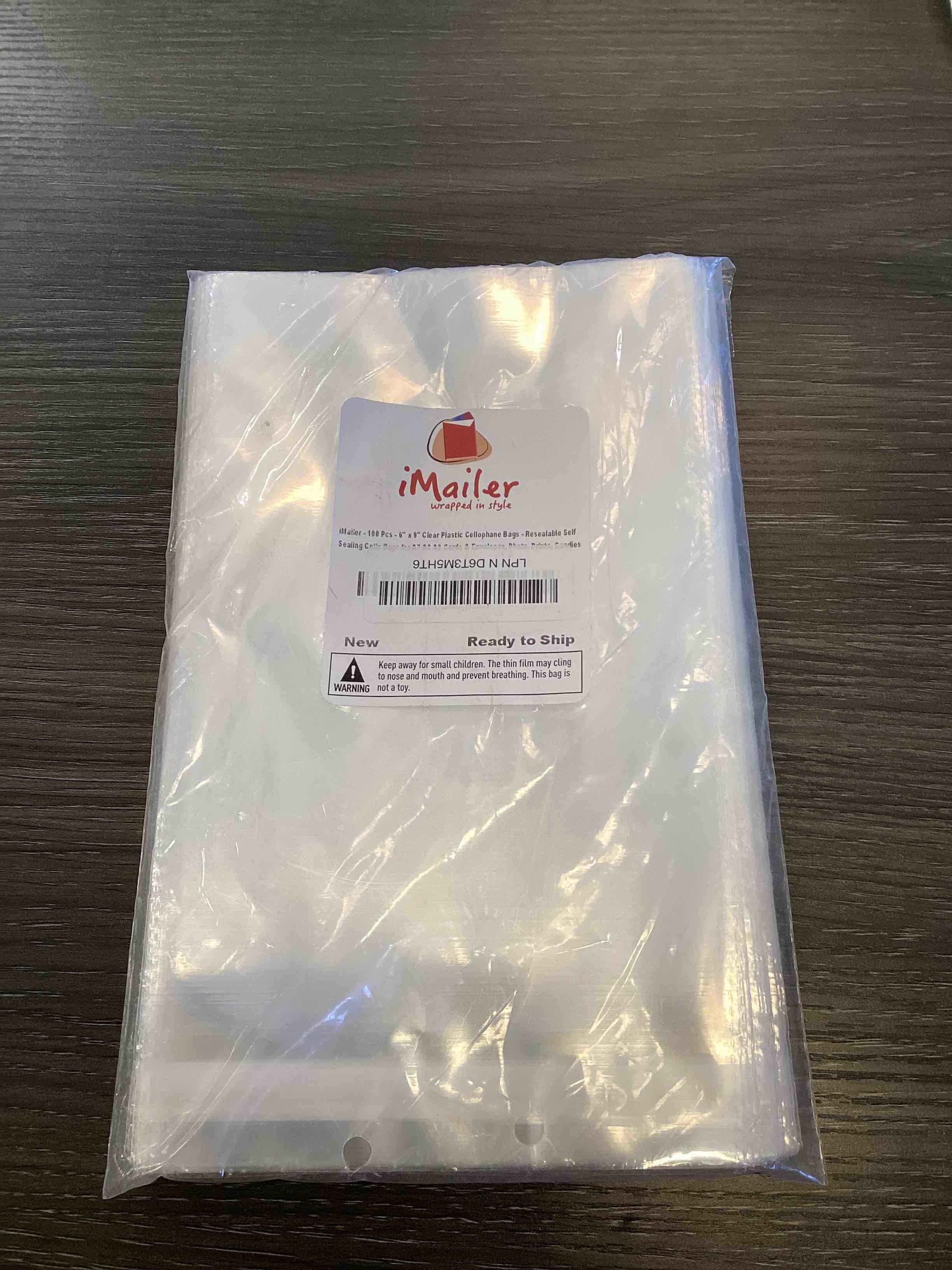 Condition photo showing As Is for imailer - 100 pcs - 6" x 9" clear plastic cellophane bags - resealable self sealing cello bags for a7 a8 a9 cards & envelopes, photo, prints, candies 1 count (pack of 100) 100 pack
