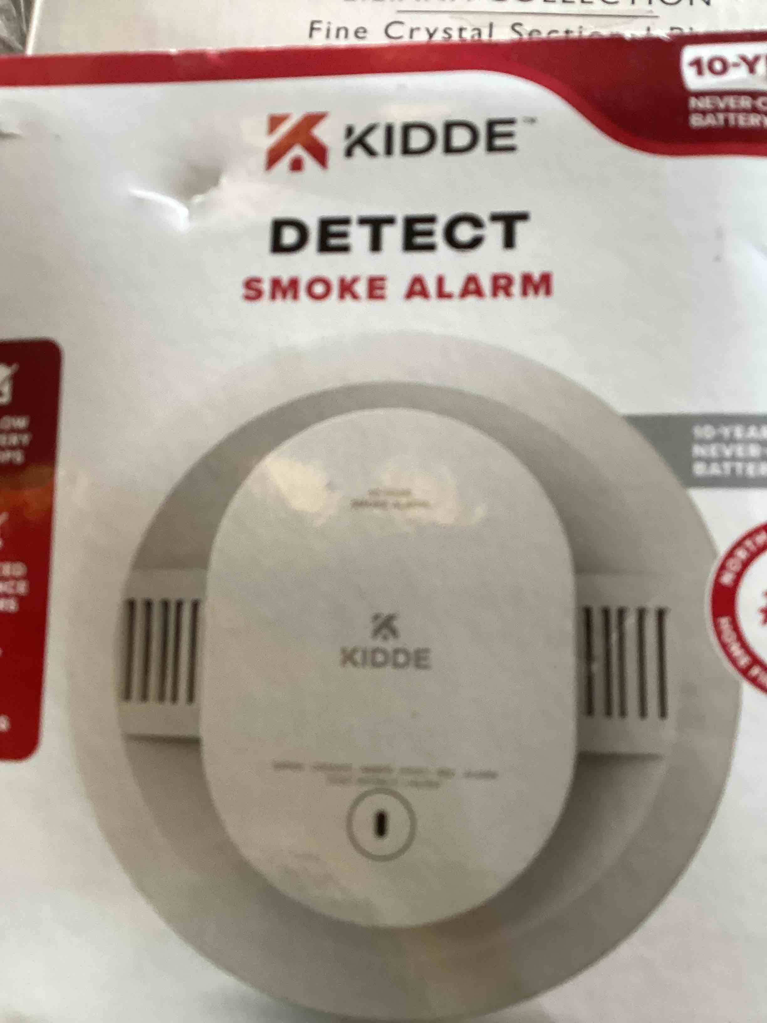 Condition photo showing As Is for 10-year battery powered smoke detector with photelectric sensor