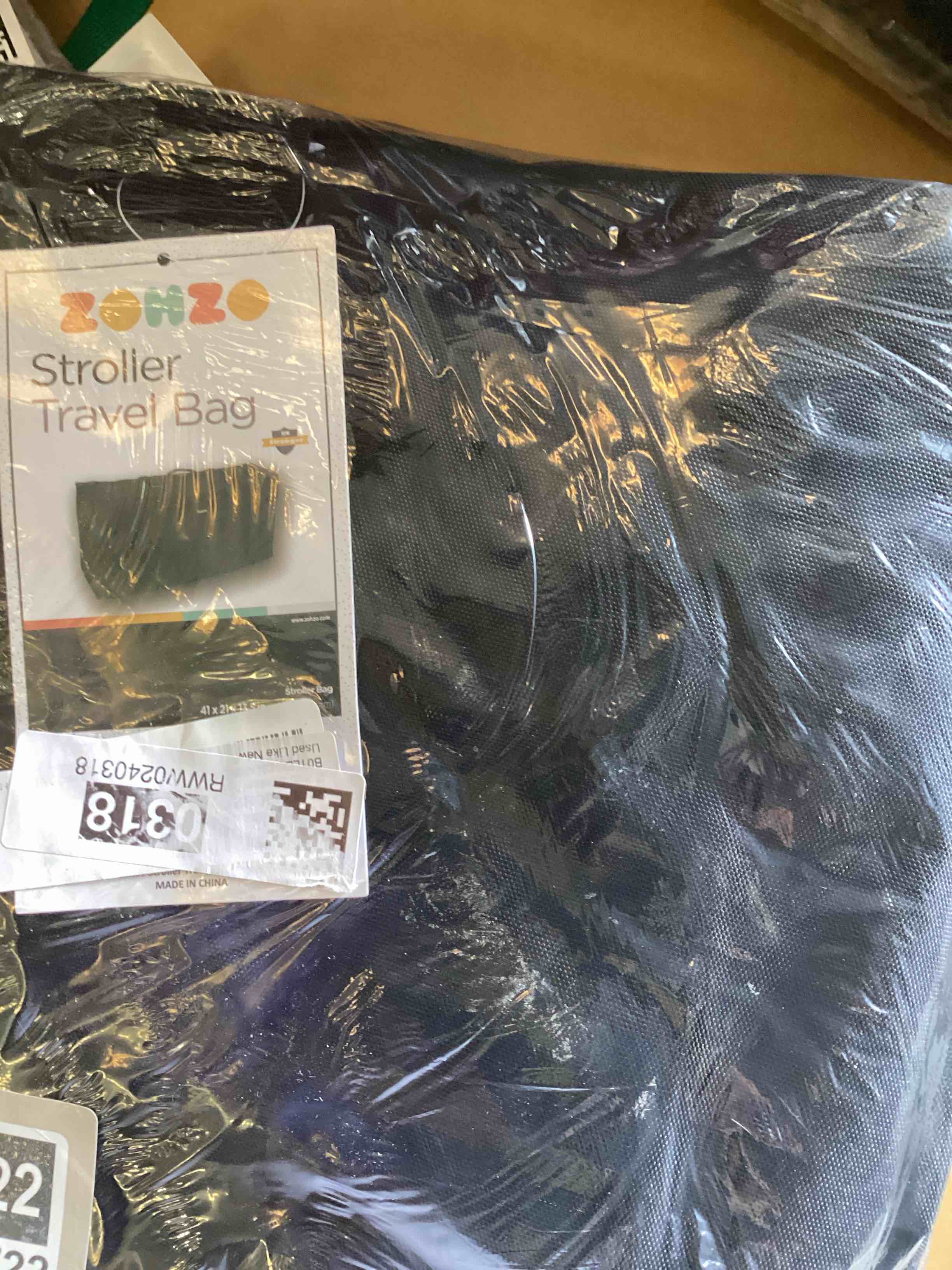 Condition photo showing As Is for stroller bag 
