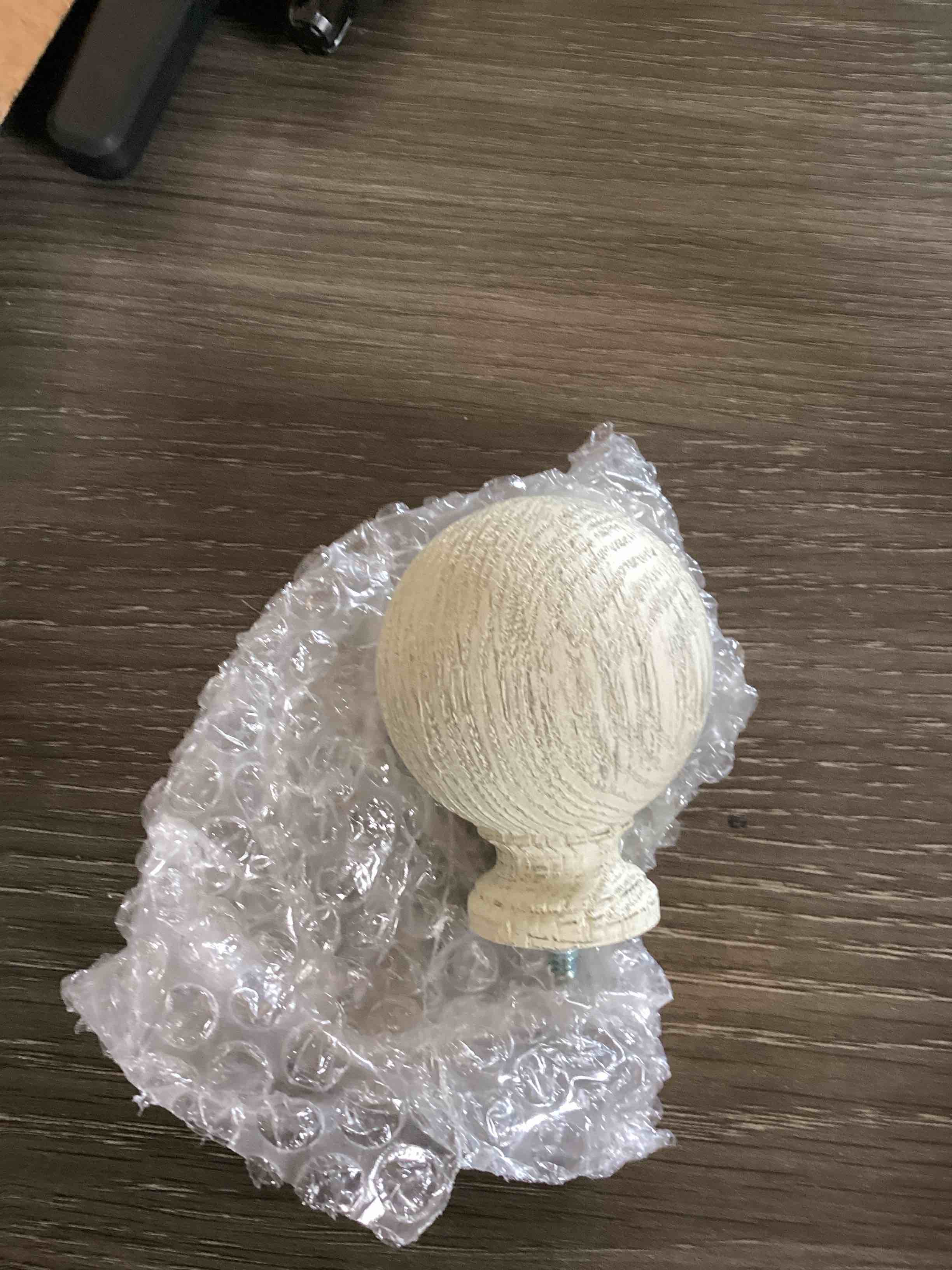 Condition photo showing As Is for this lumi home furnishings white wood curtain rod finial features a textured, spherical ball