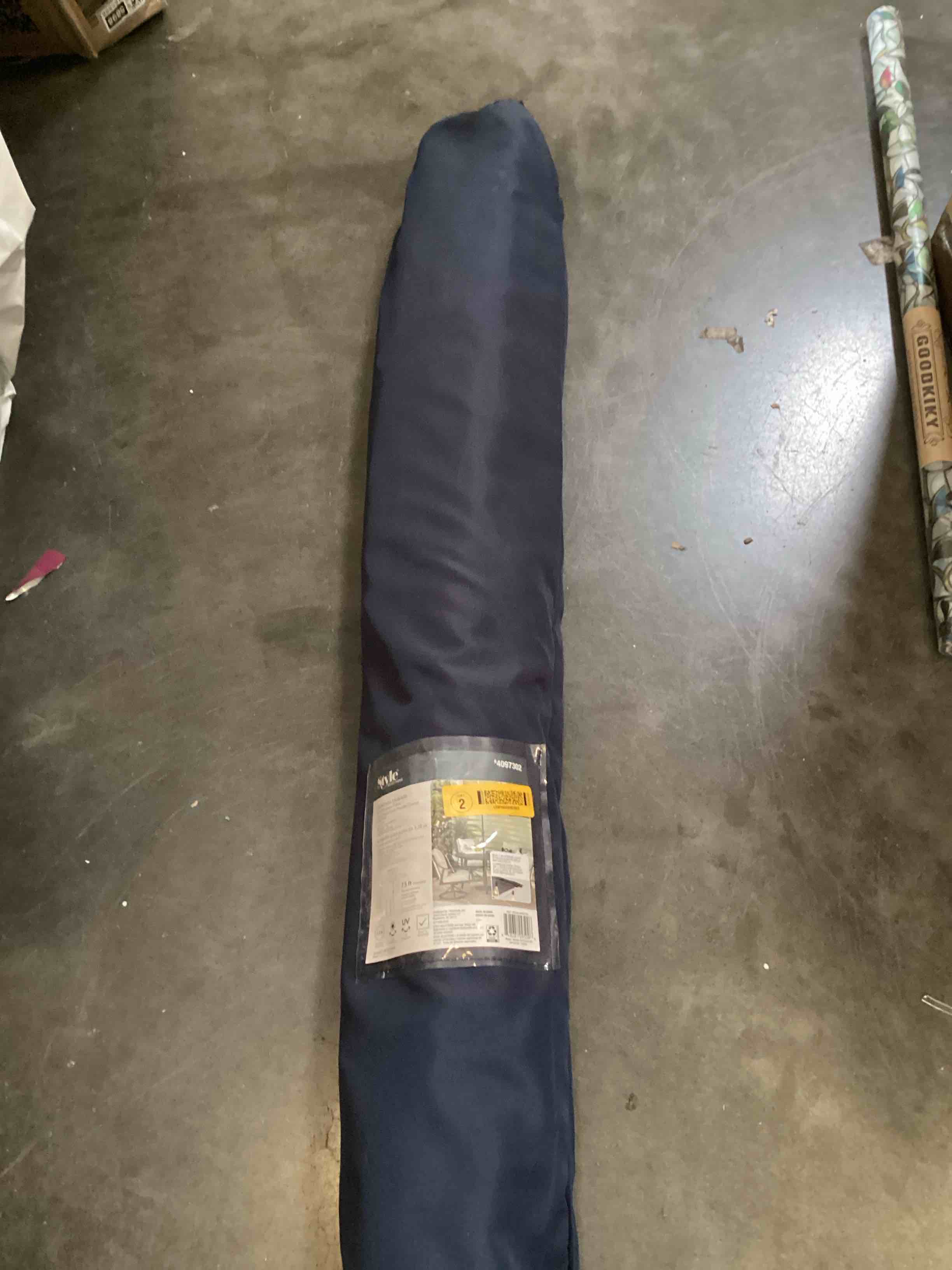 Condition photo showing As Is for 7.5 ft patio umbrella navy polyester fabric 