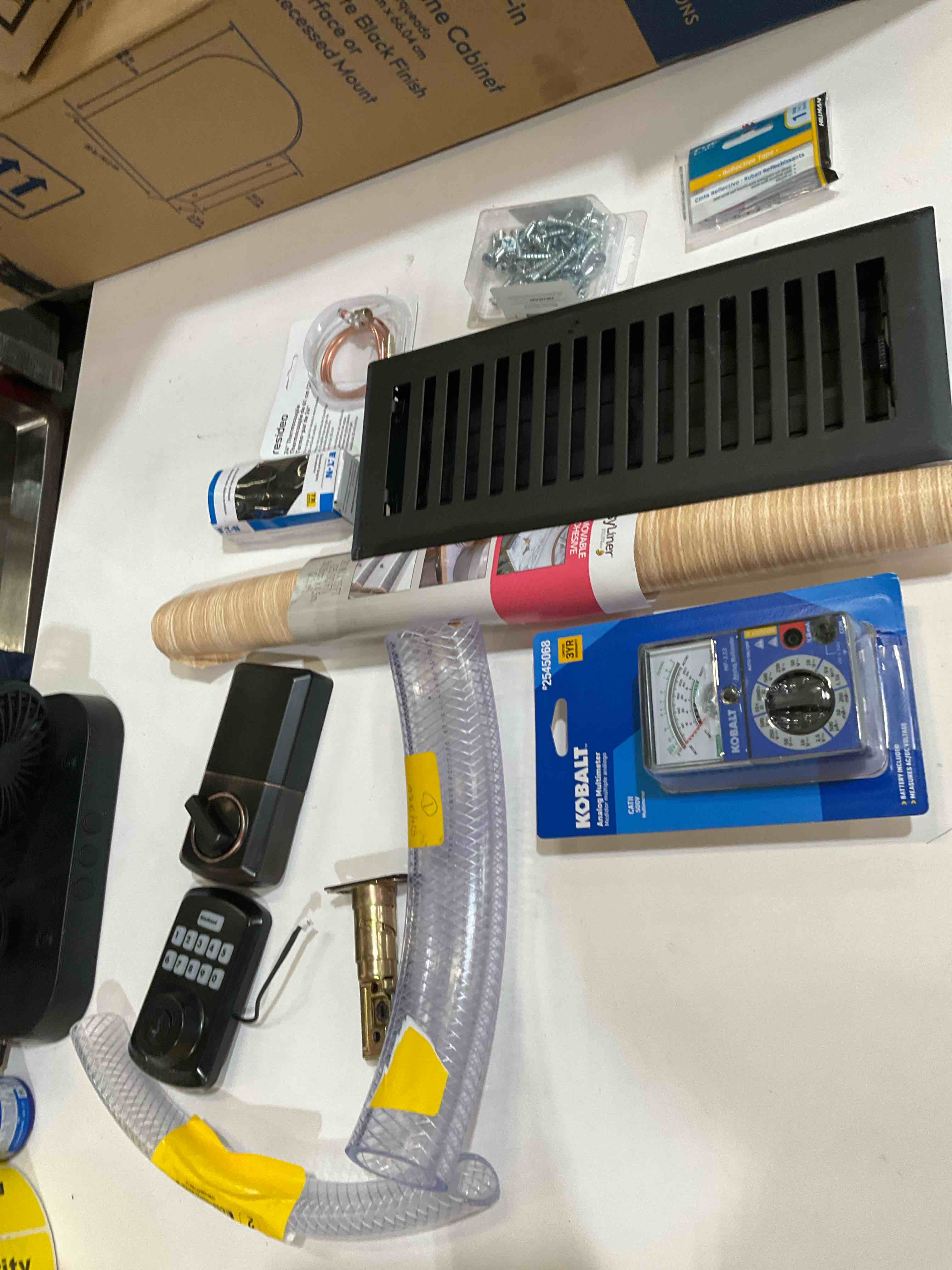Condition photo showing As Is for assorted home improvement lot (small tools, screw, home accessories, etc.)