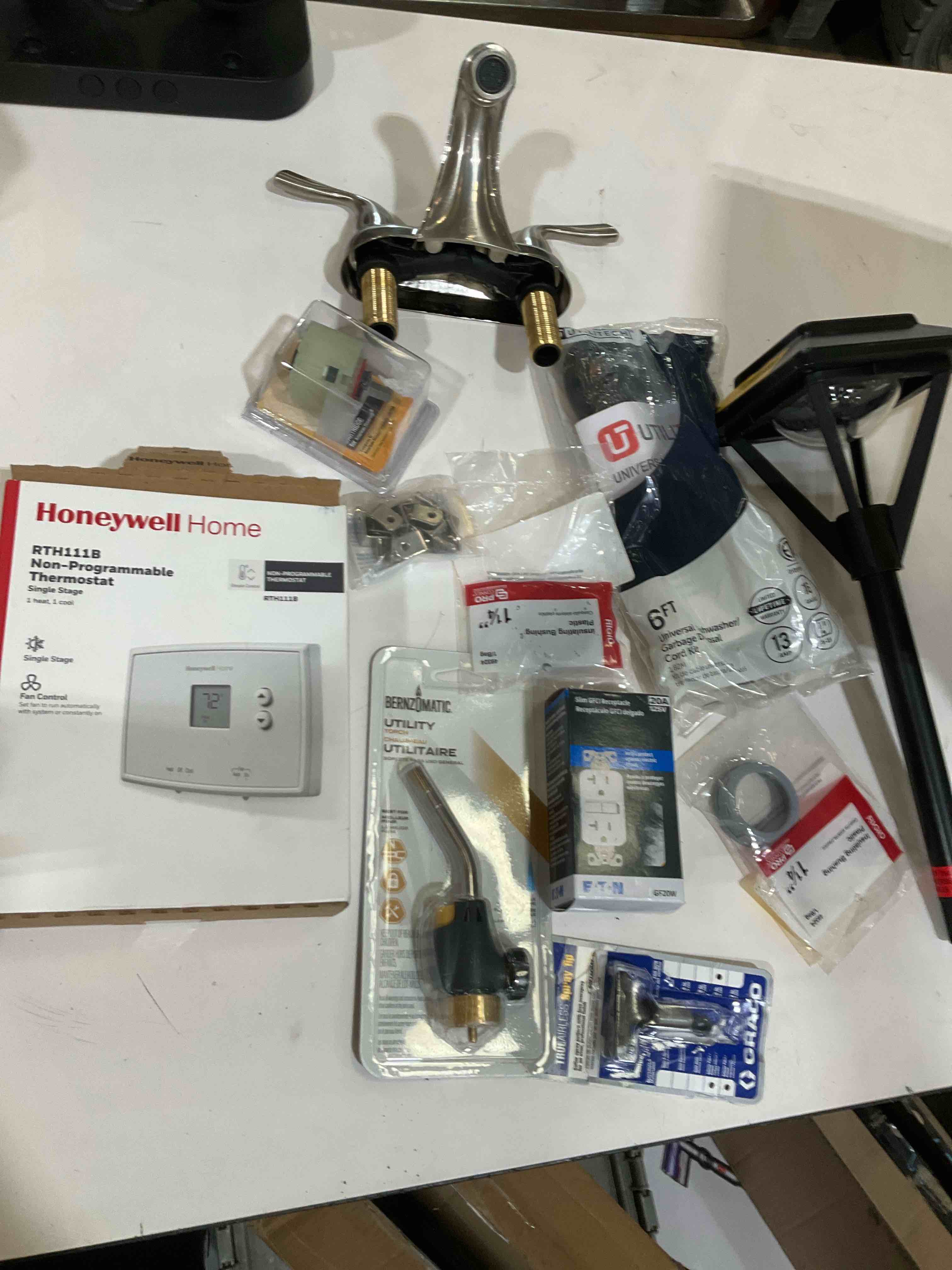 Condition photo showing As Is for assorted home improvement lot (small tools, screw, home accessories, etc.)