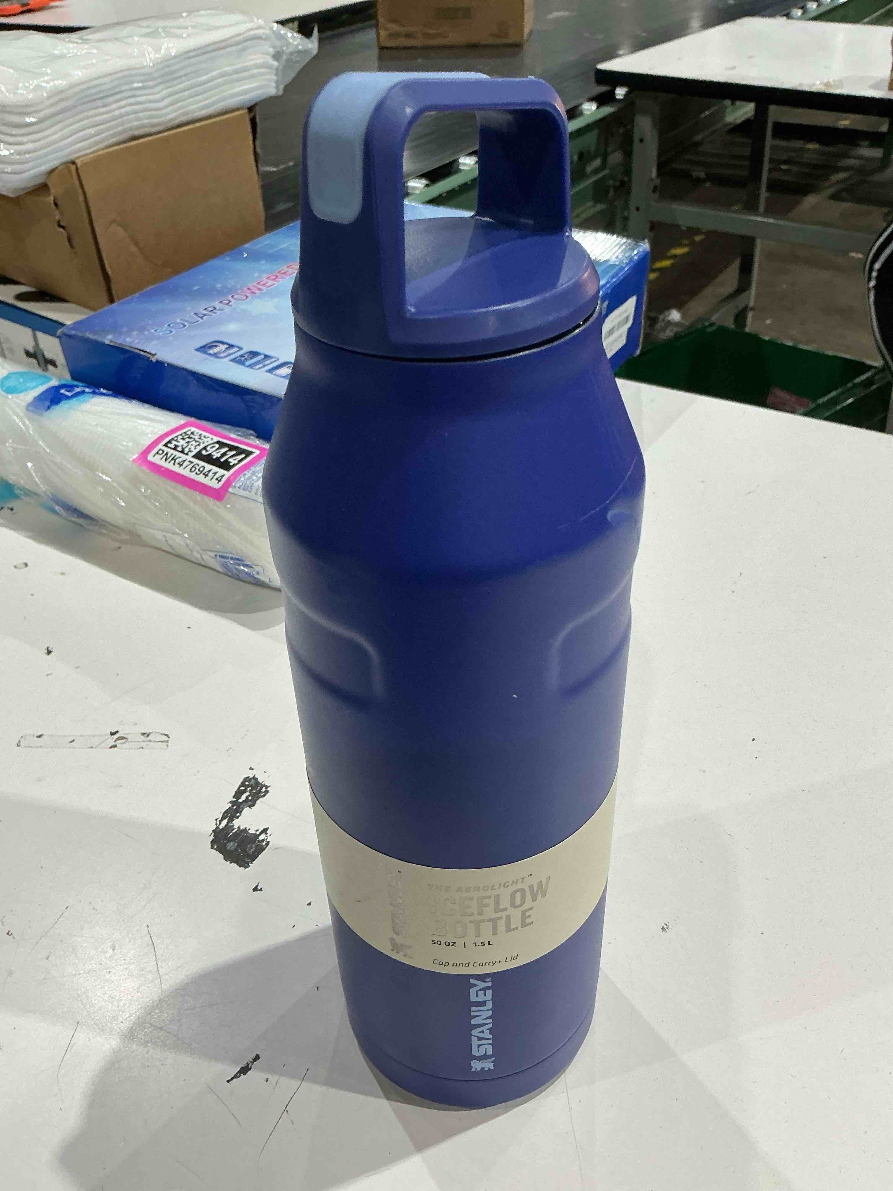 stanley iceflow cap and carry water bottle | wide mouth twist lid | lightweight & leakproof for travel & sports | insulated stainless steel | bpa-free lapis 50 oz